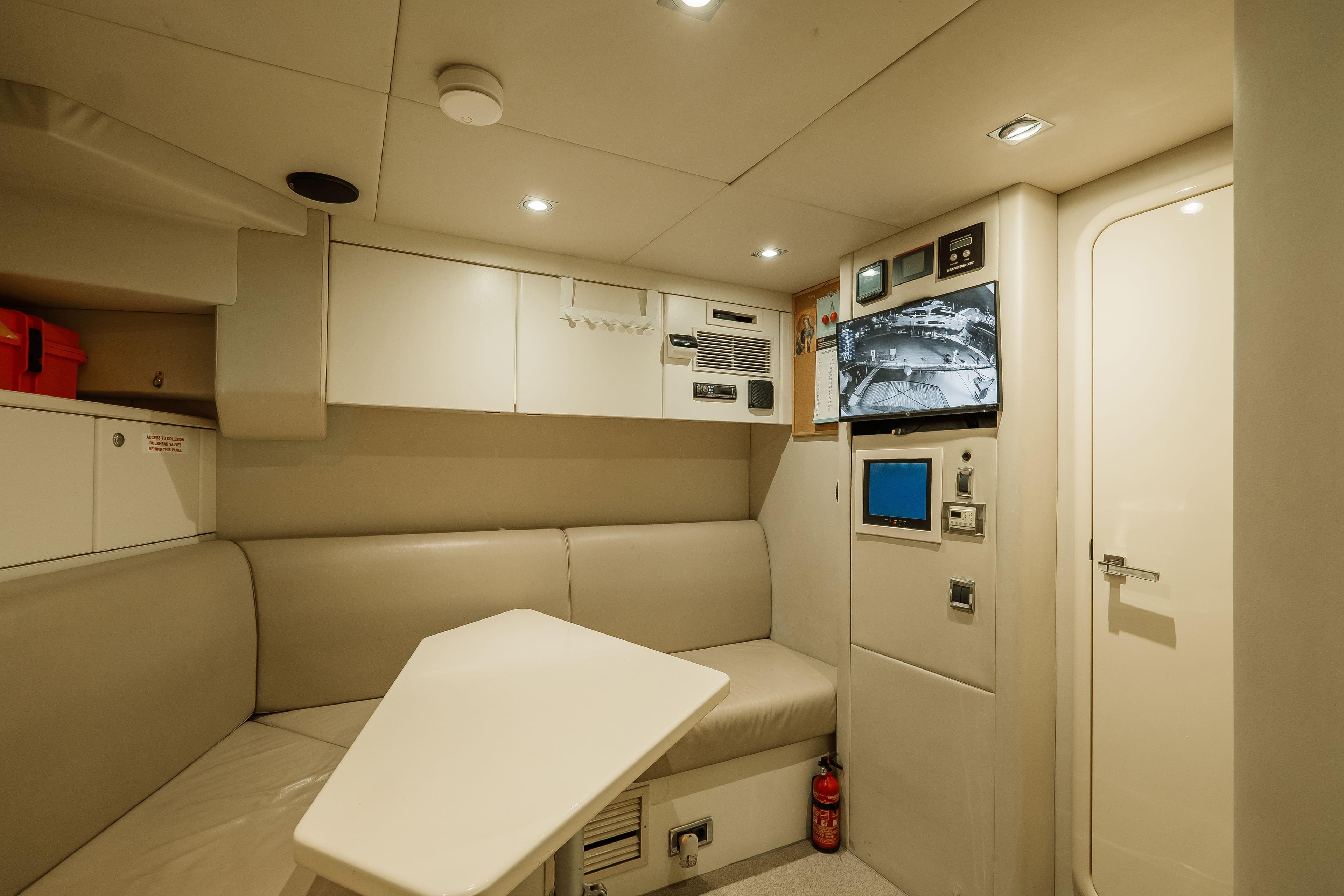 Luxurious interior of 2009 Sunseeker 30 Metre Yacht with modern seating and control panels.