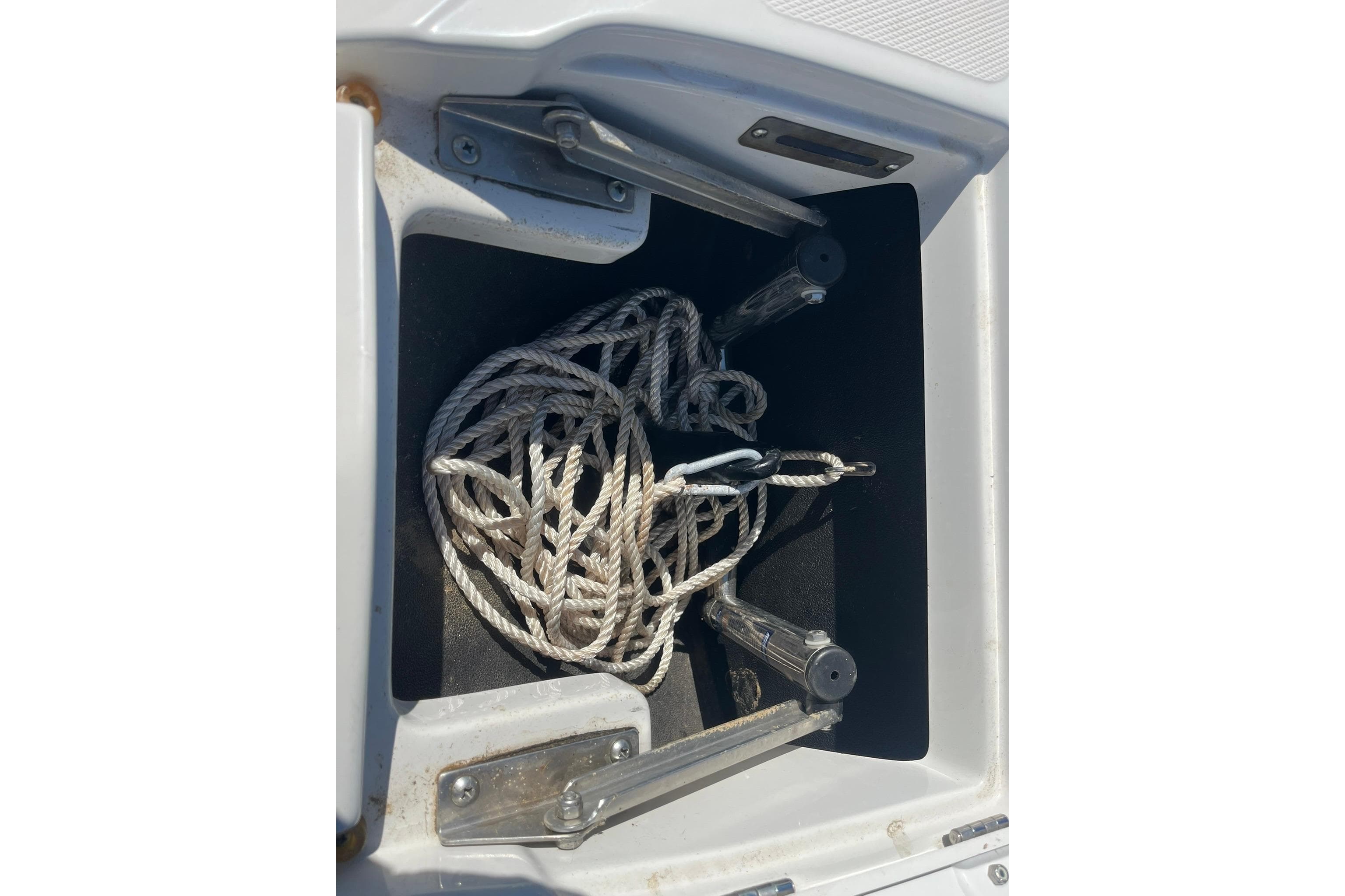 2010 Crownline 210 LS boat anchor storage with rope inside.