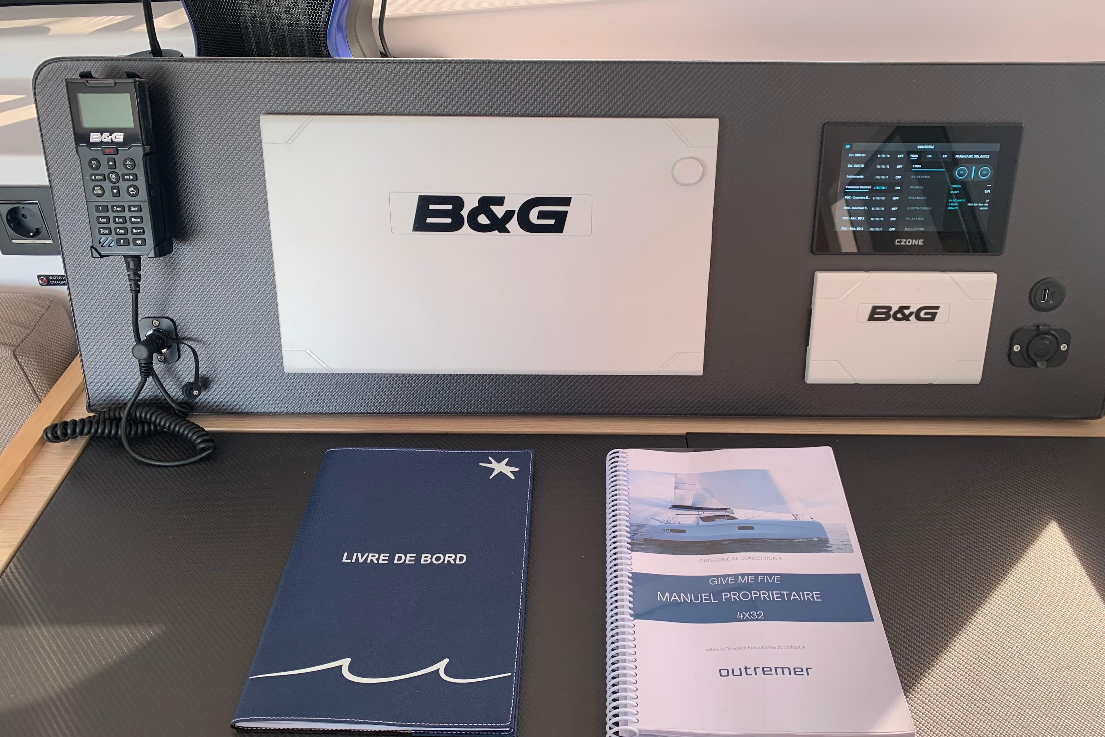 Control panel of 2025 Outremer 4X yacht with manuals and B&G equipment.