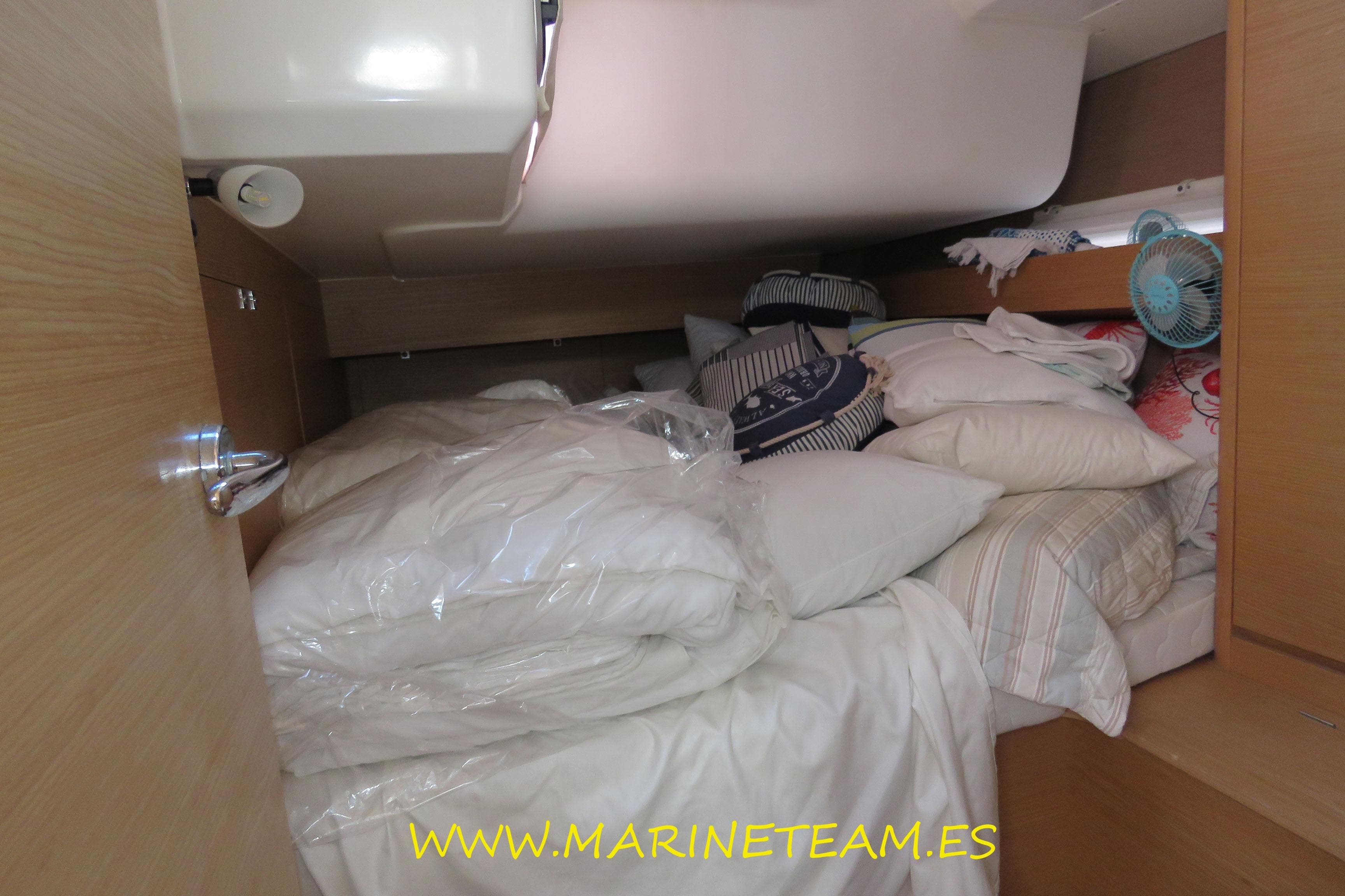Cozy cabin interior of 2017 Dufour 460 Grand Large yacht with bedding and pillows.