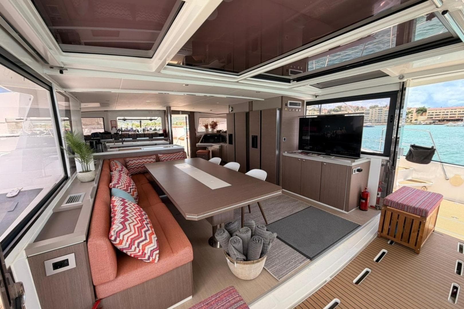 Luxurious interior of 2020 Bali 5.4 yacht with modern dining area and ocean view.