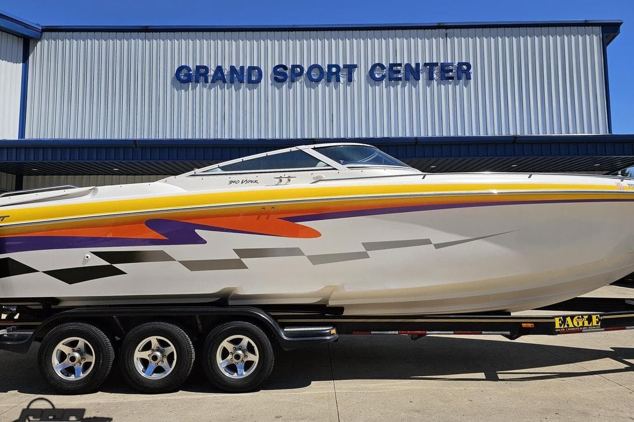 2001 Powerquest 340 Vyper boat with vibrant graphics at Grand Sport Center.