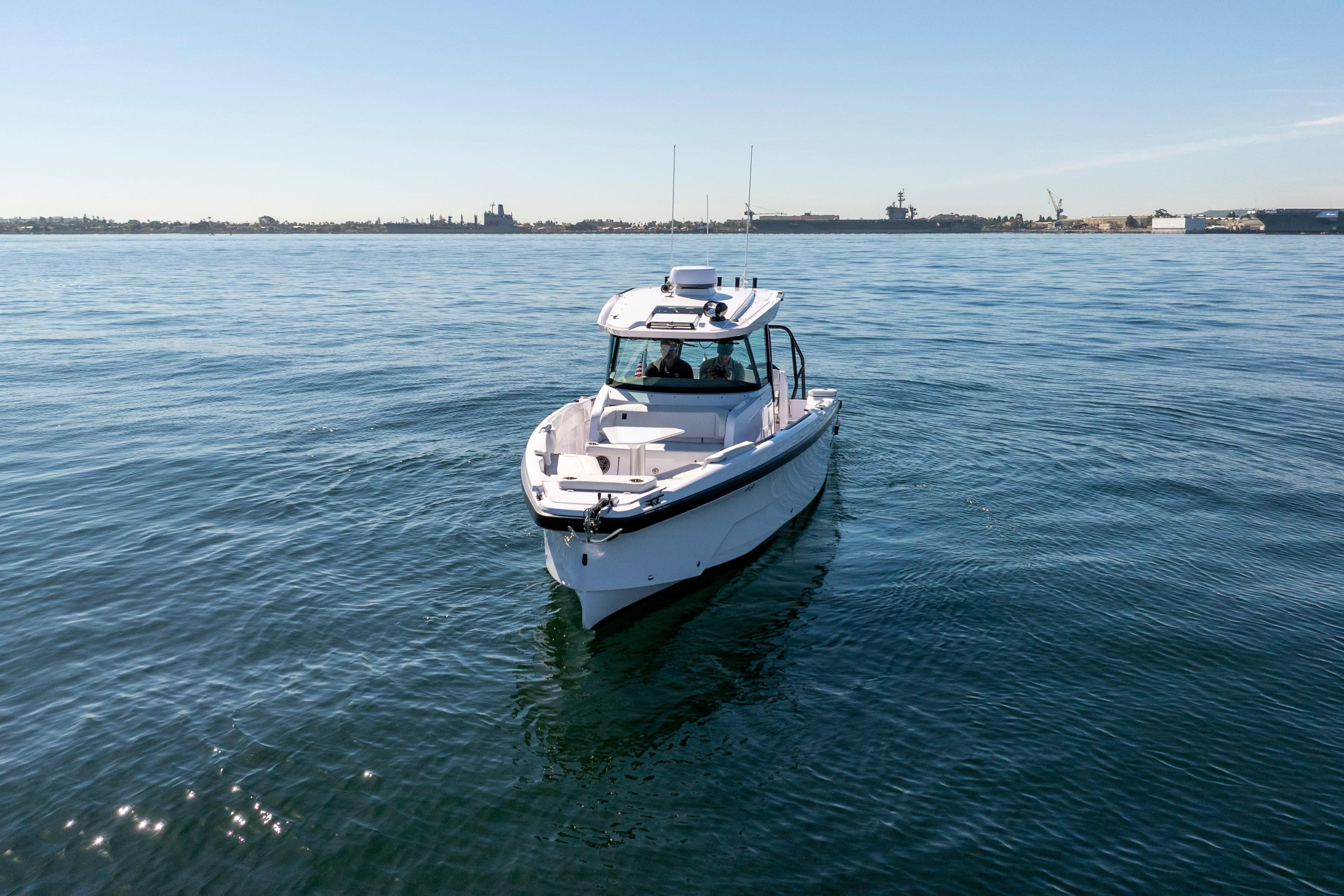 2026 Axopar AX29 CCX boat cruising on calm blue waters.