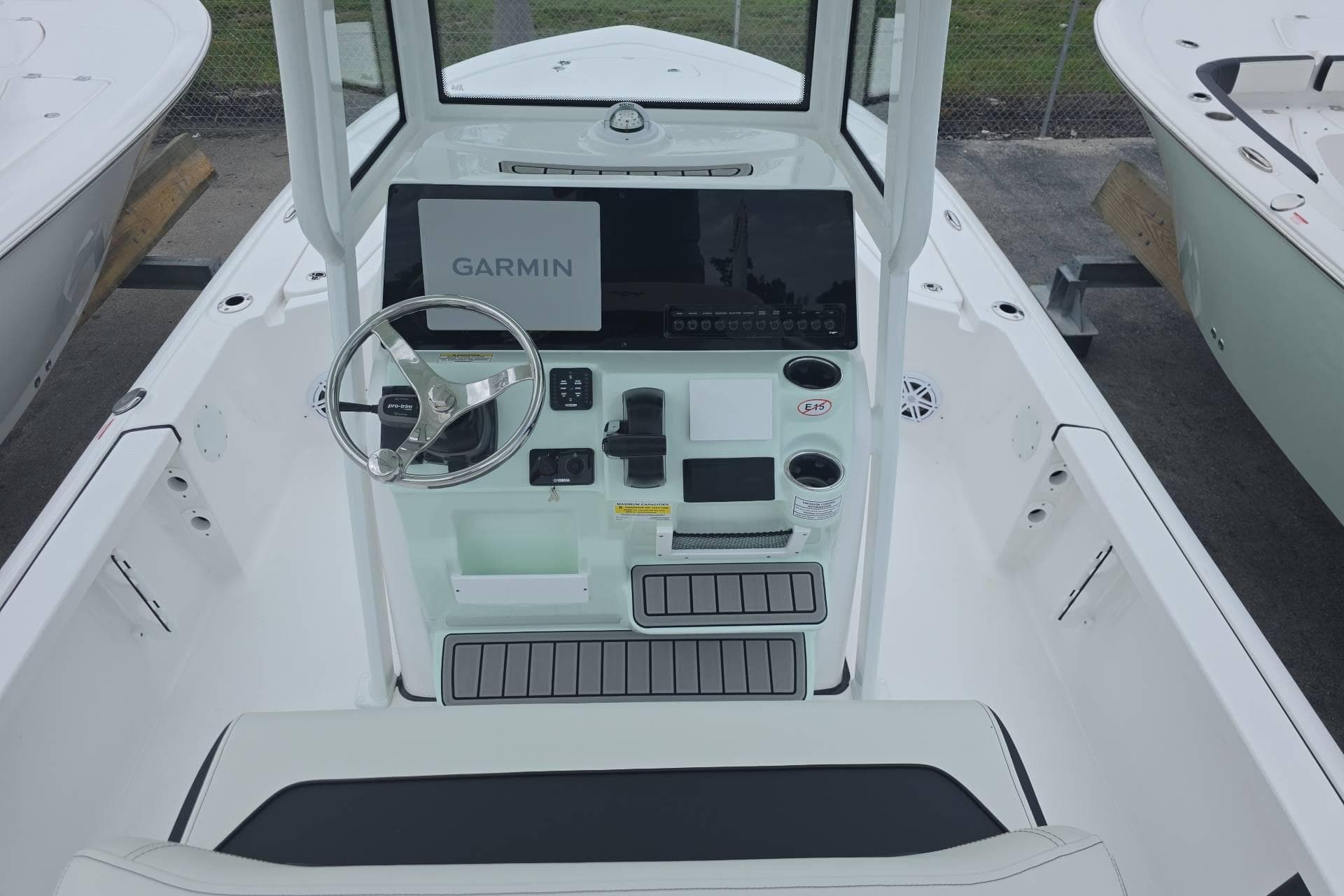 2026 Tidewater 2110 Bay Max boat console with Garmin display and steering wheel.