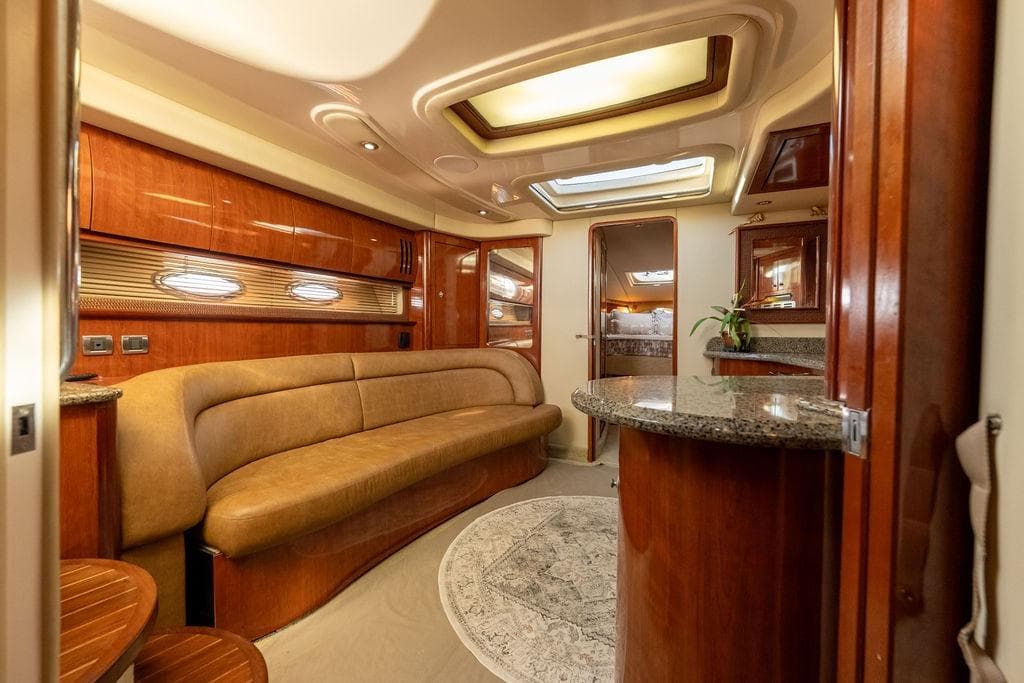 Luxurious interior of 2005 Sea Ray 420 Sundancer yacht with elegant wood finishes.
