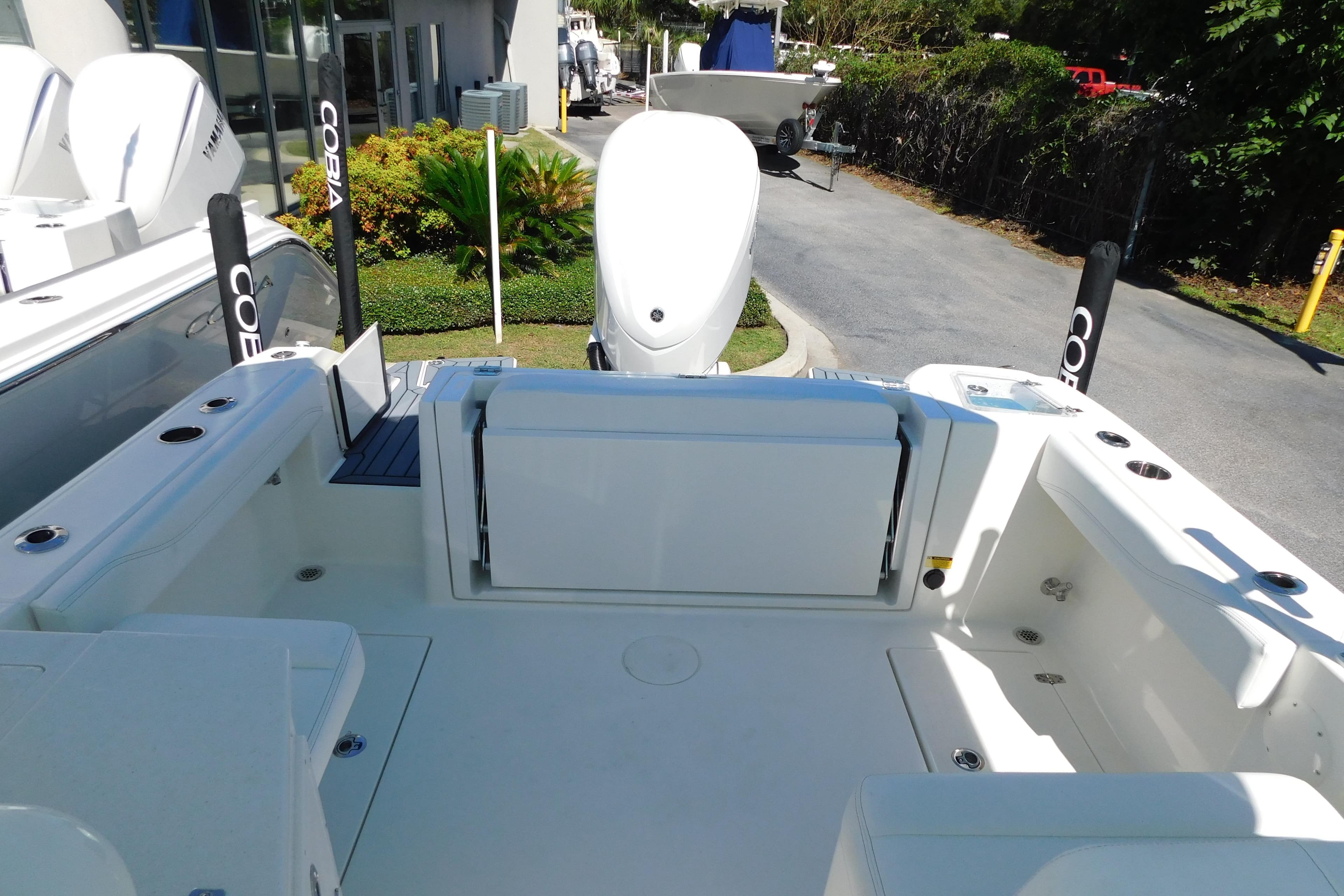 2026 Cobia 240 Dual Console boat with spacious deck and seating area.