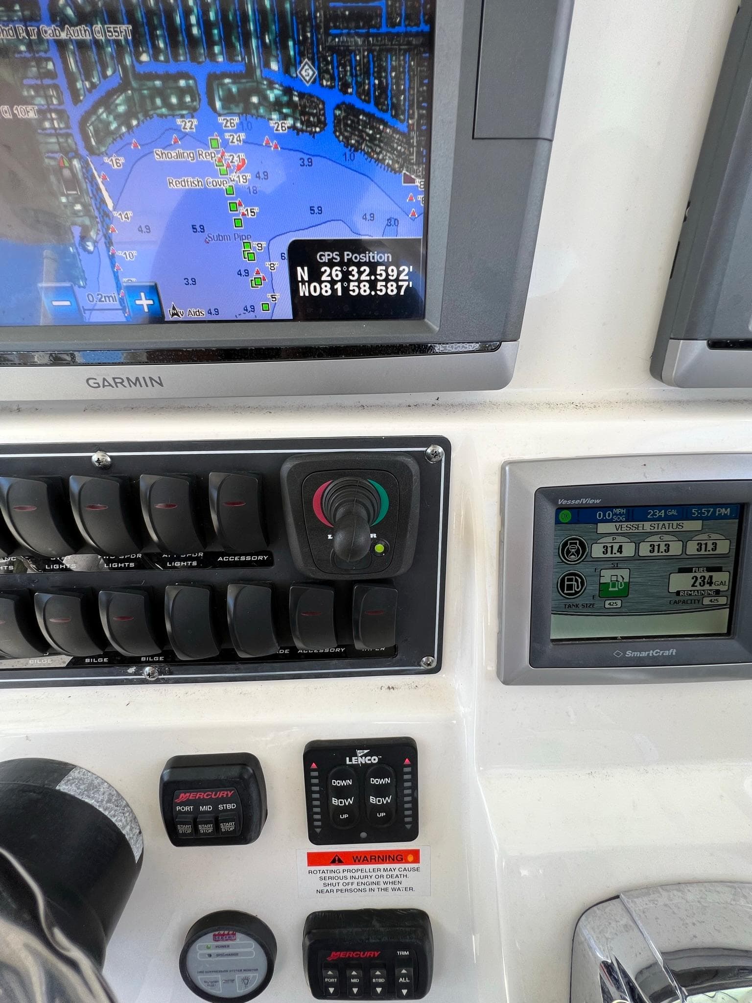 Control panel of a 2013 Boston Whaler 370 Outrage with GPS and navigation systems.