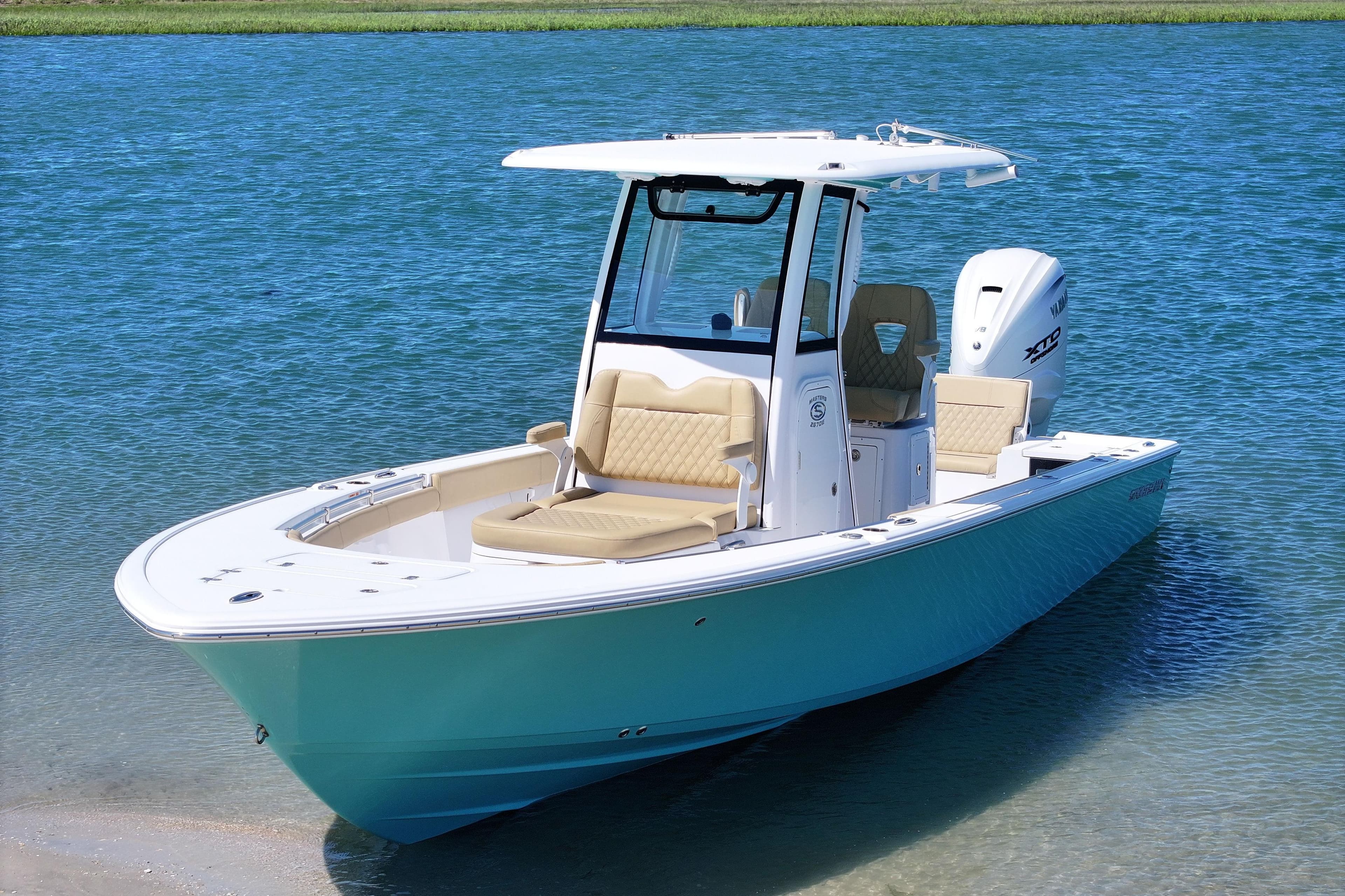 2024 Sportsman Masters 267 Bay Boat on clear blue water.