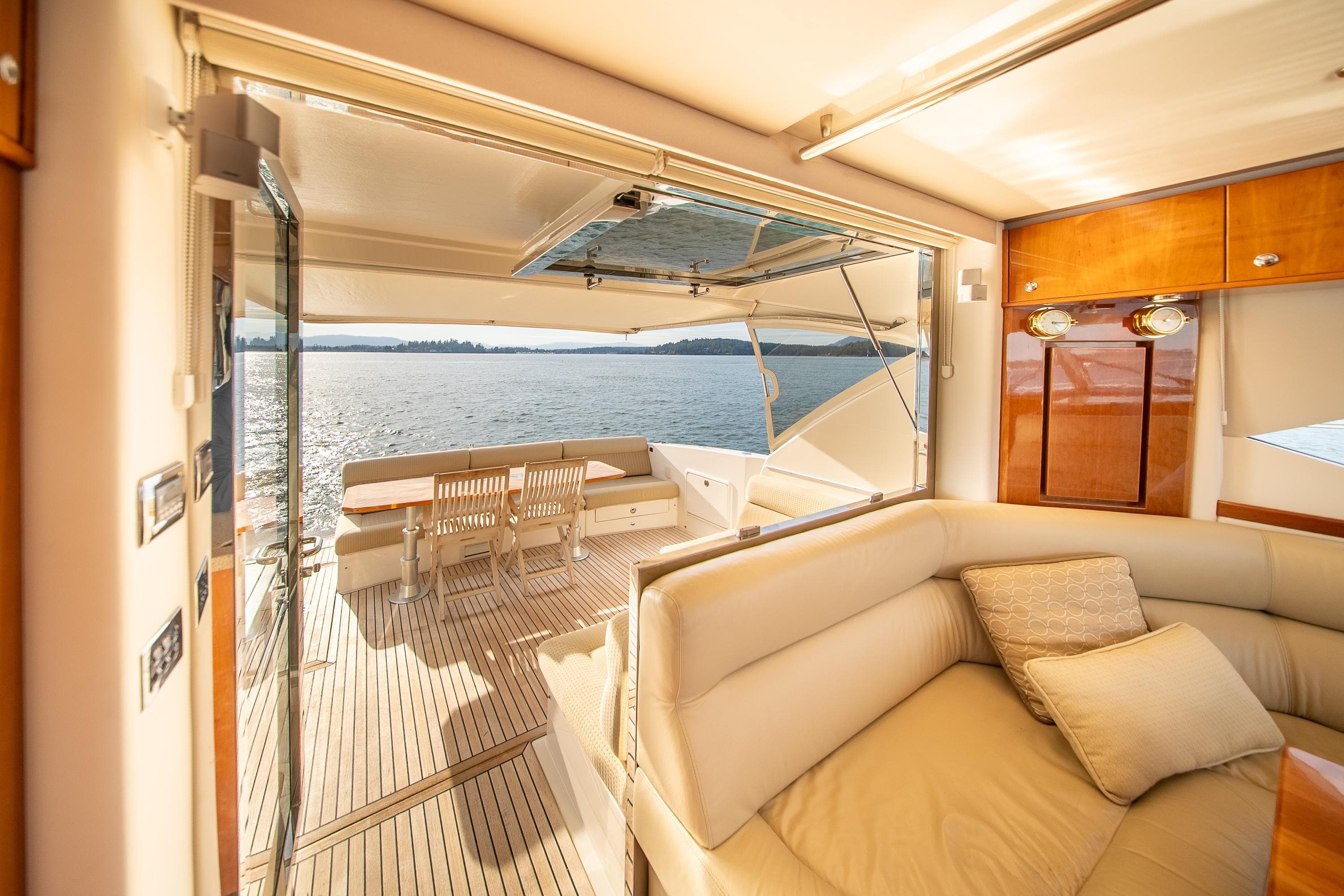 Luxurious interior of 2011 Riviera 5000 Sport Yacht with scenic ocean view.