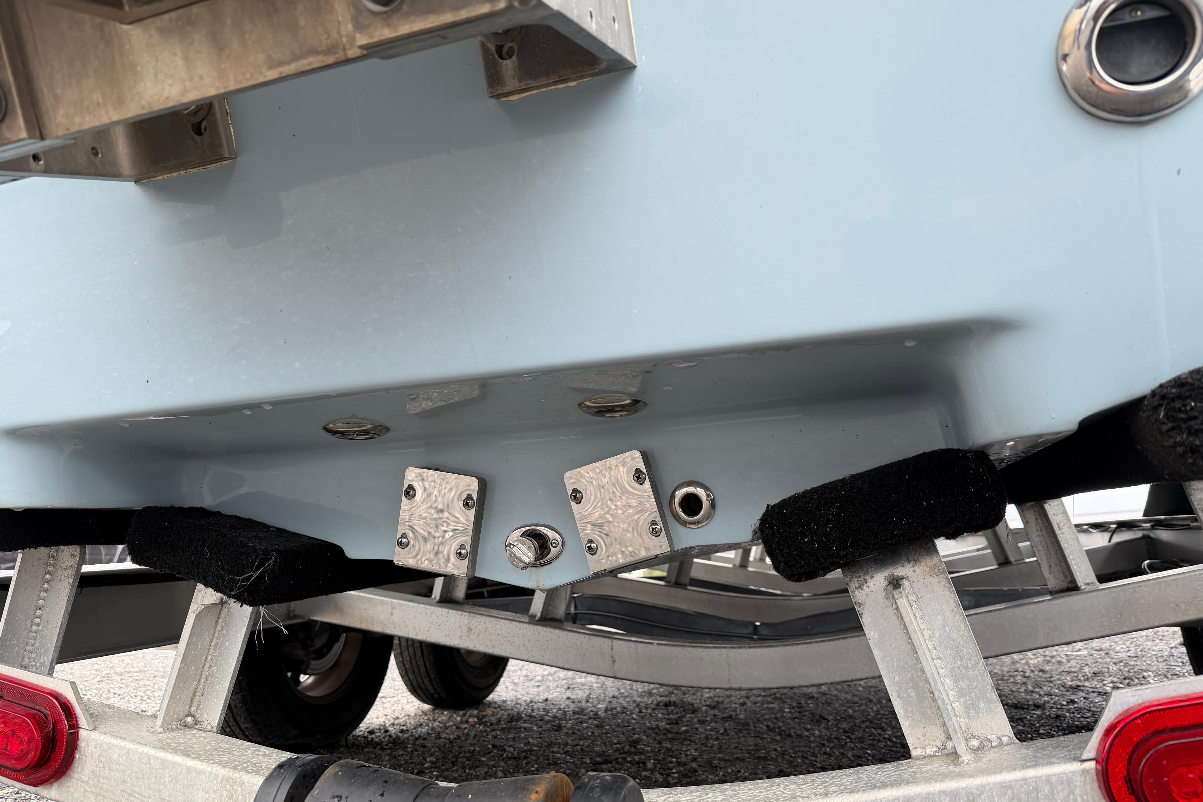 Skeeter SX241 2025 boat hull on trailer, showing underside and fittings.