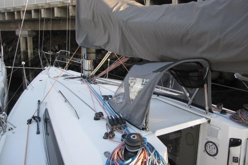 2018 Jeanneau Sun Fast 3600 sailboat deck with covered boom and rigging.