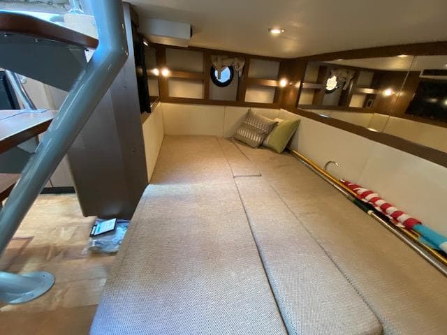 Interior cabin of 2015 Sea Ray 350 Sundancer with cozy seating and modern design.