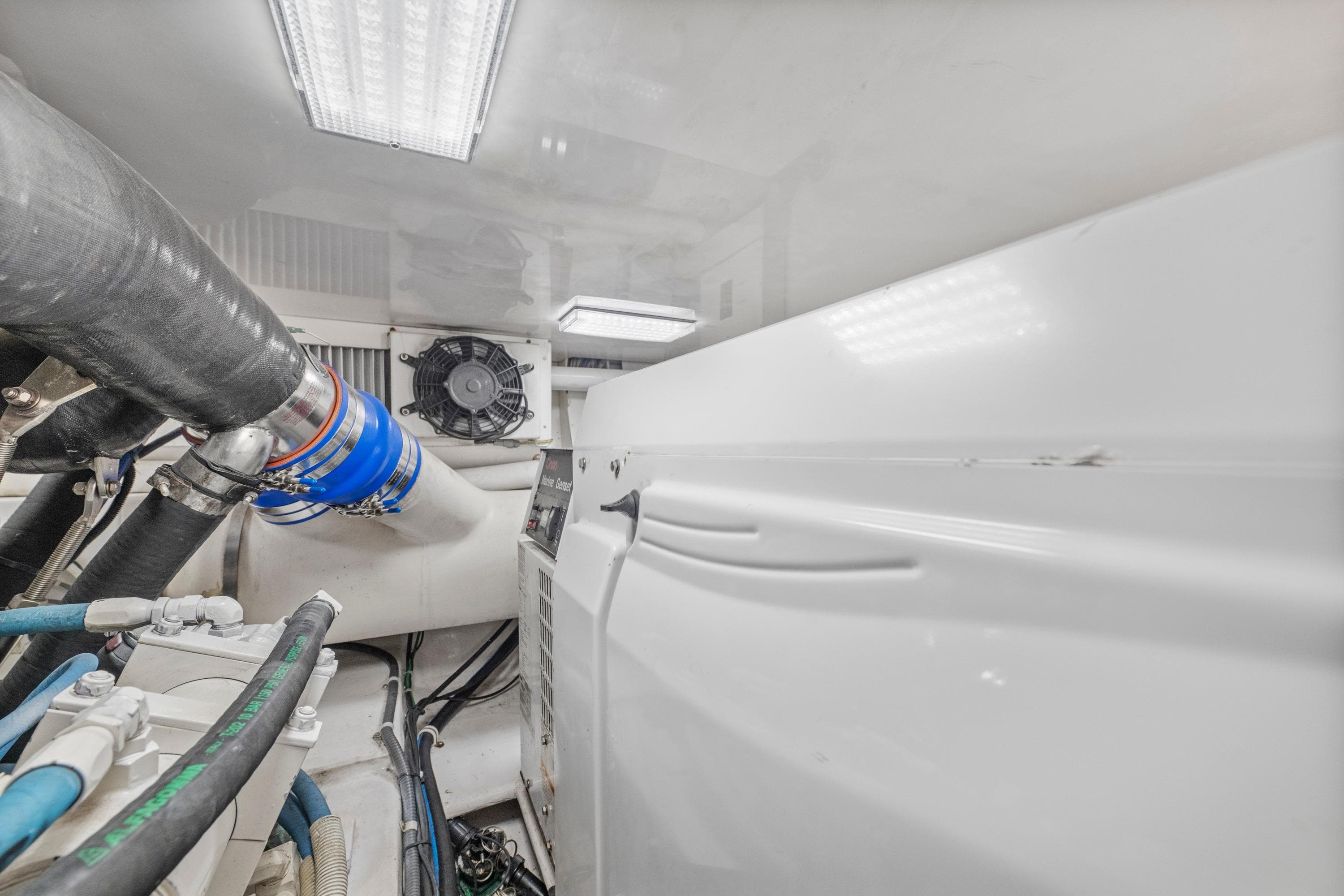 Engine room of a 2008 Viking Convertible yacht with visible pipes and machinery.