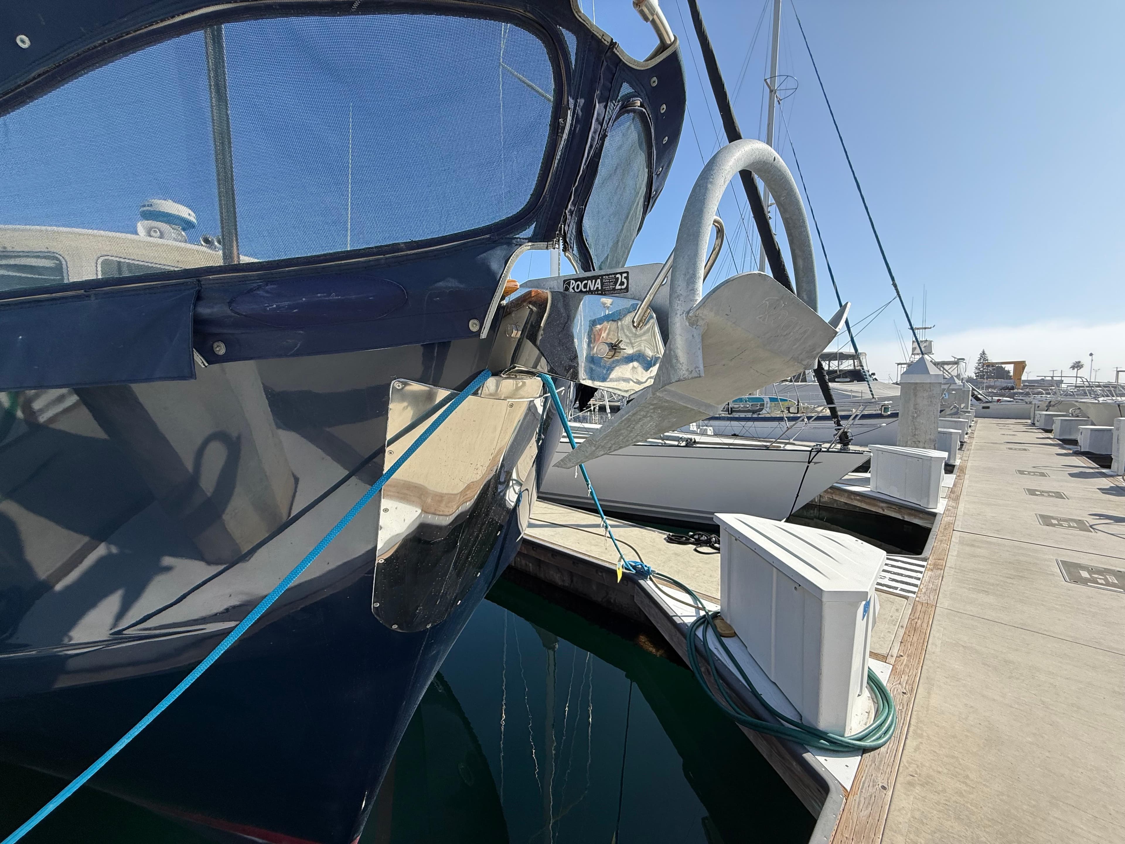 1978 Fisher 38 Trawler docked, showcasing anchor and bow details.