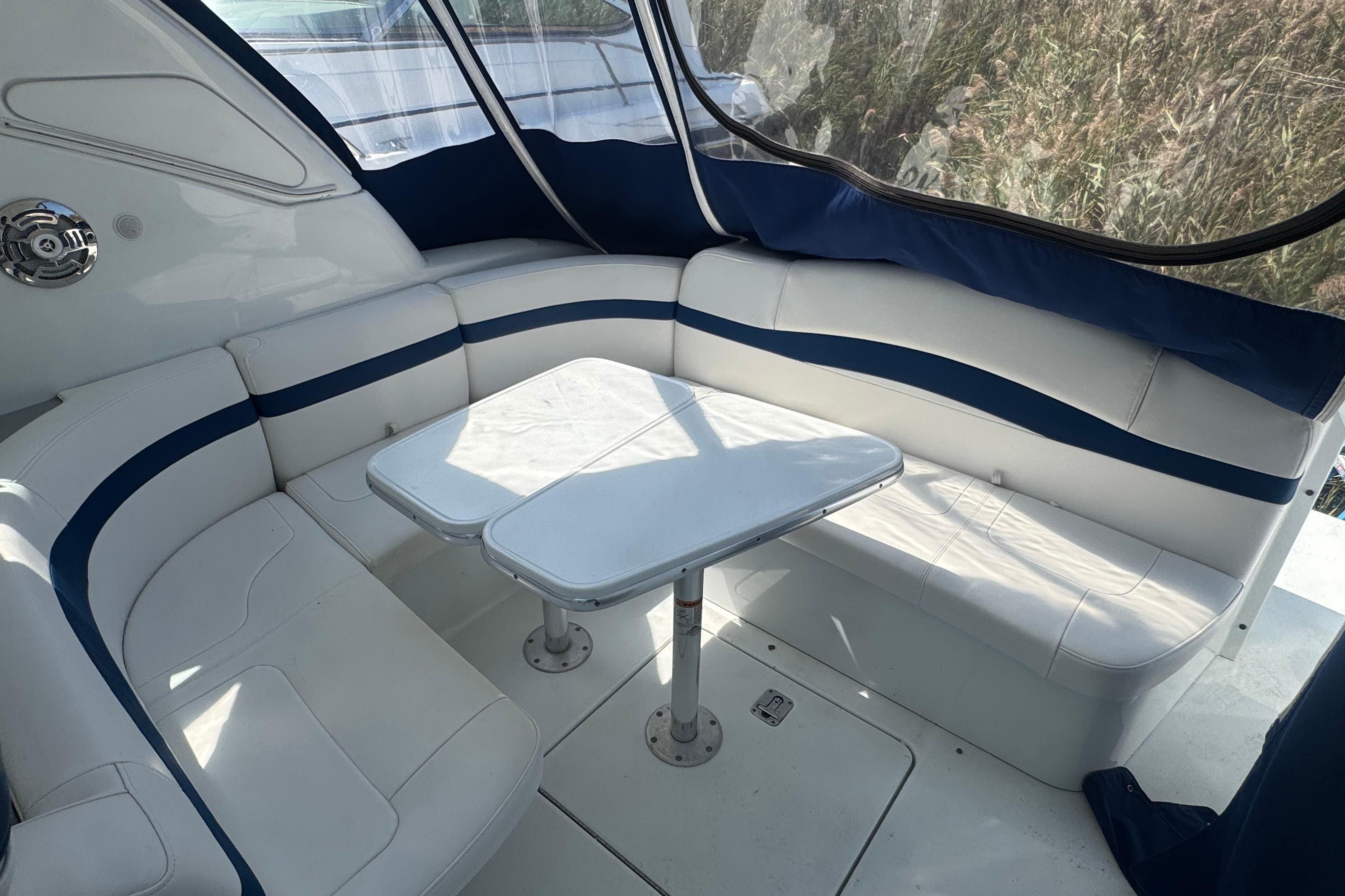 2011 Formula 37 Performance Cruiser interior with white seating and table.