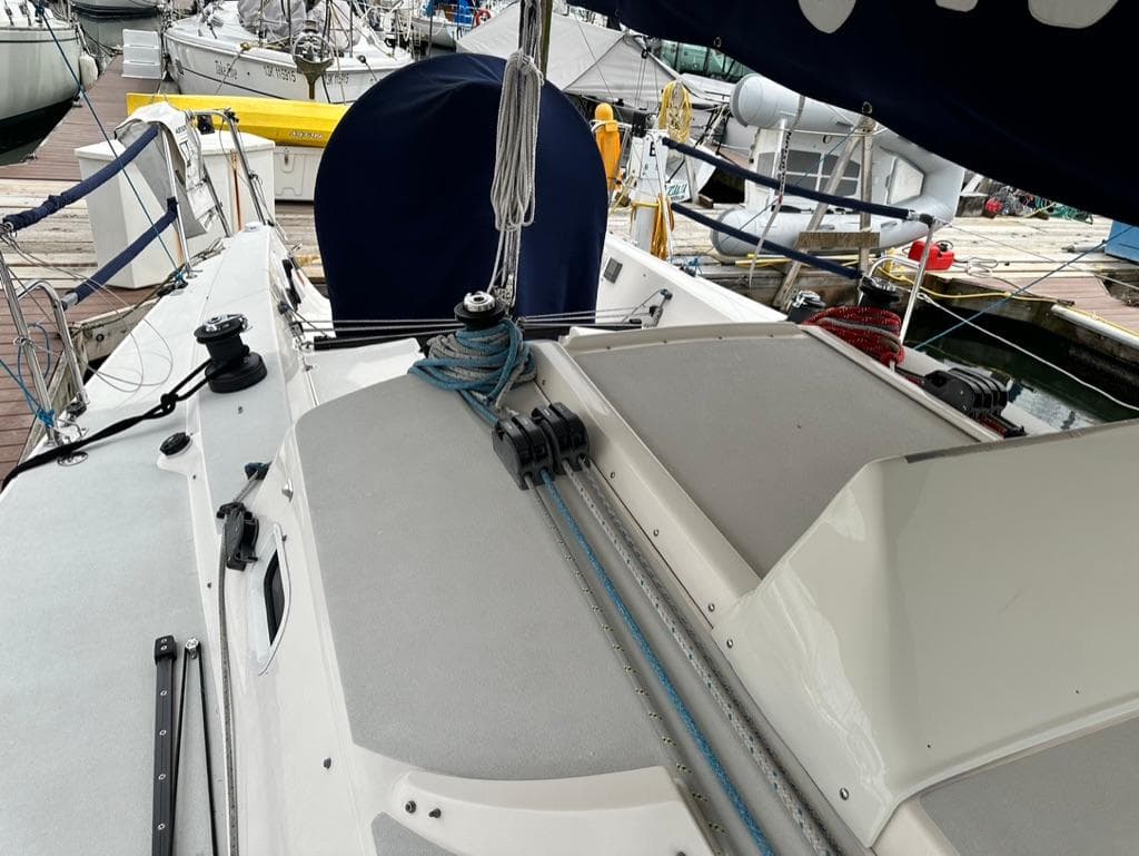 2006 J Boats J/109 sailboat deck with rigging and winches at a marina.