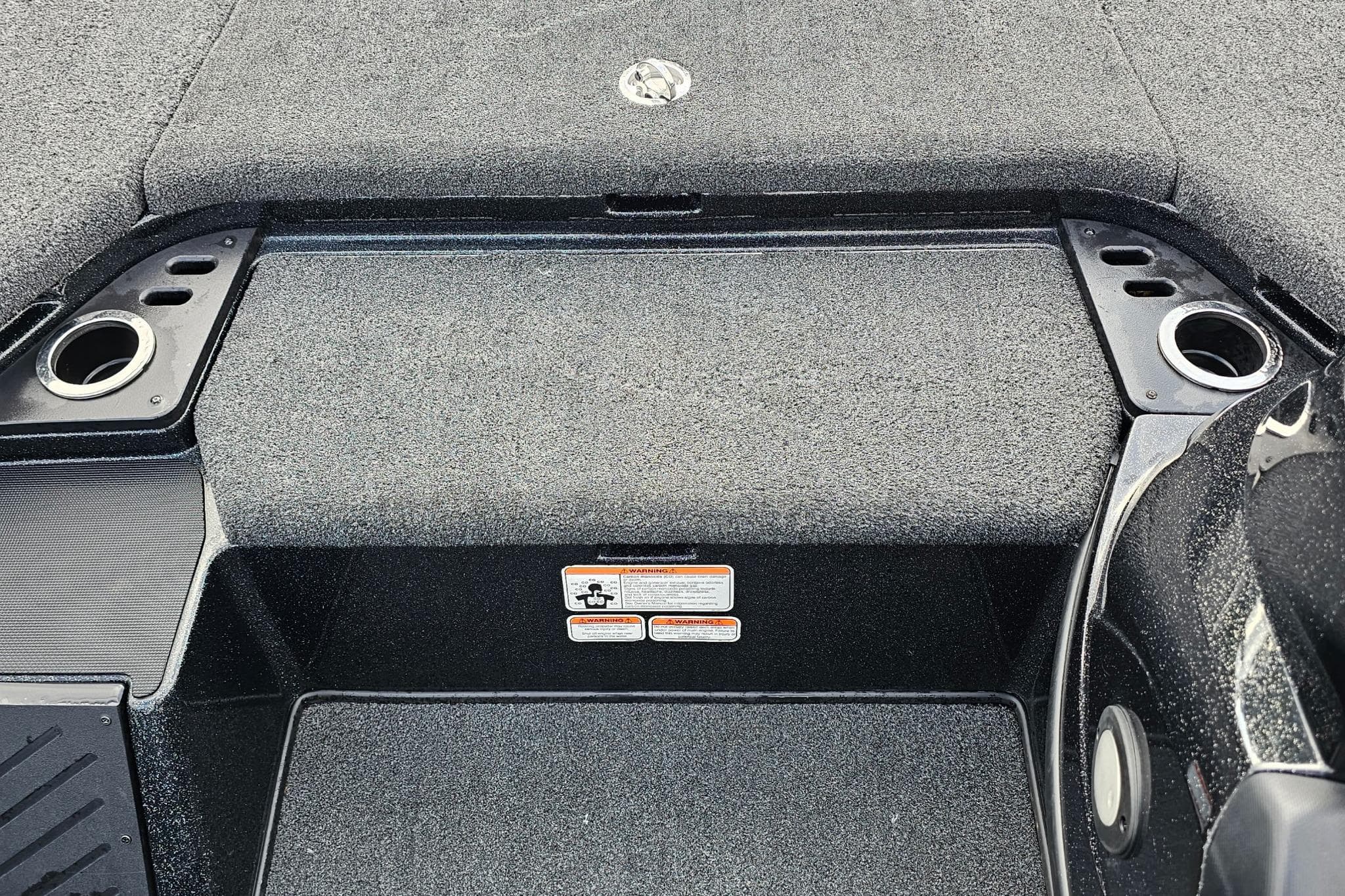 Interior of a 2017 Nitro Z20 Pro boat, featuring carpeted flooring and cup holders.