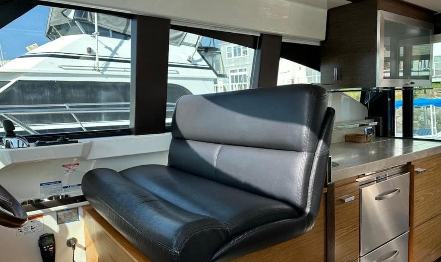 2015 Tiara Yachts C44 Coupe interior with leather seating and modern kitchen amenities.