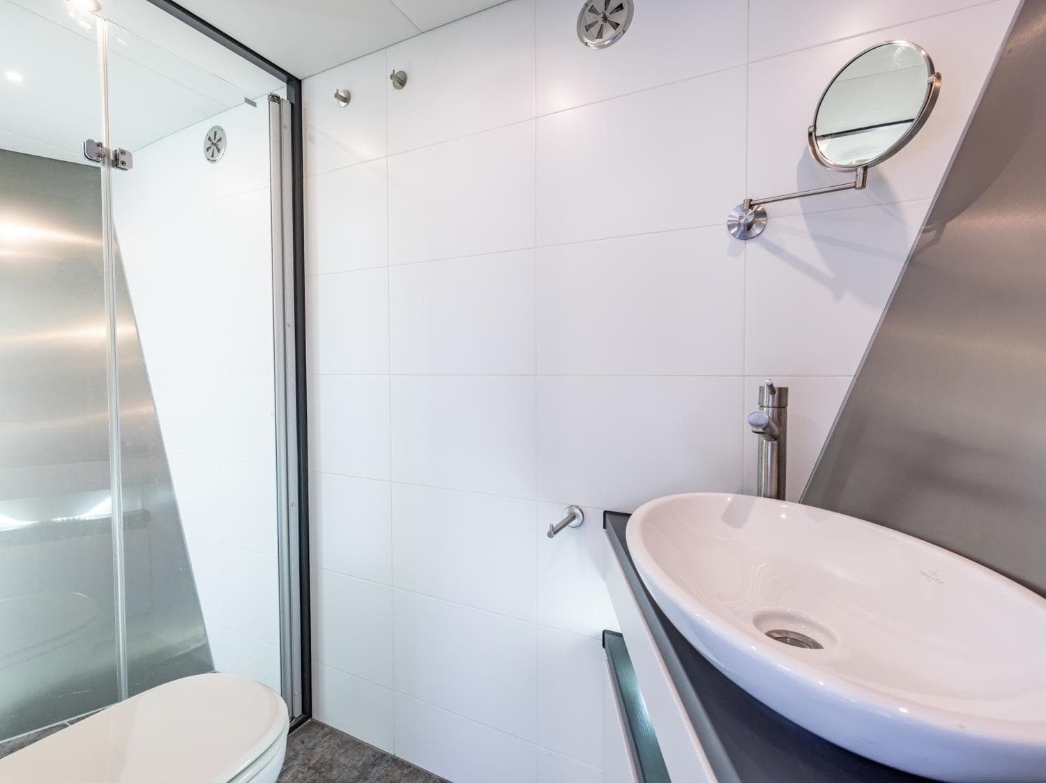 Modern bathroom in 2013 Bekebrede Luxemotor yacht with sleek sink and shower.