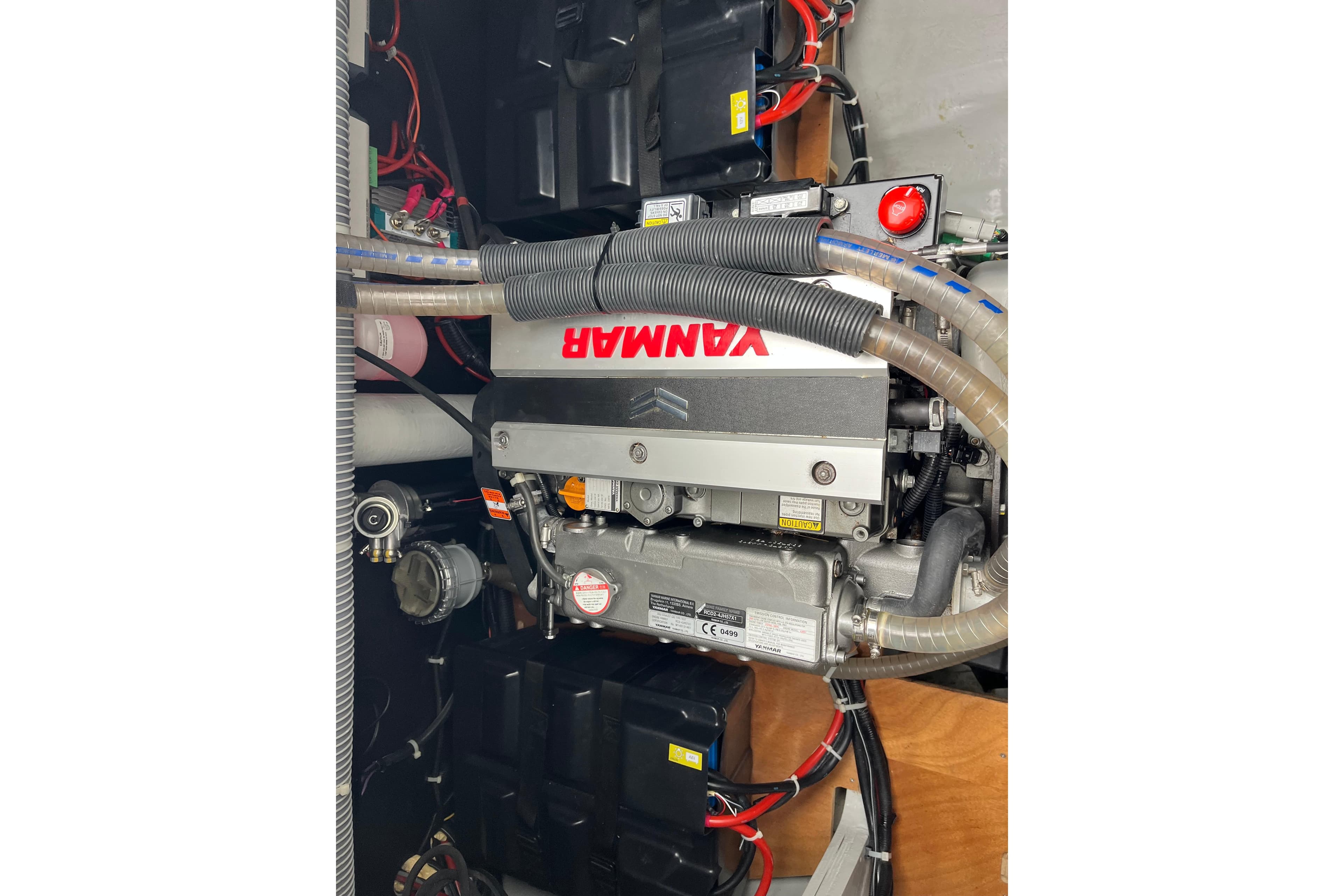 Engine compartment of a 2020 Lagoon 46 catamaran featuring a Yanmar engine.