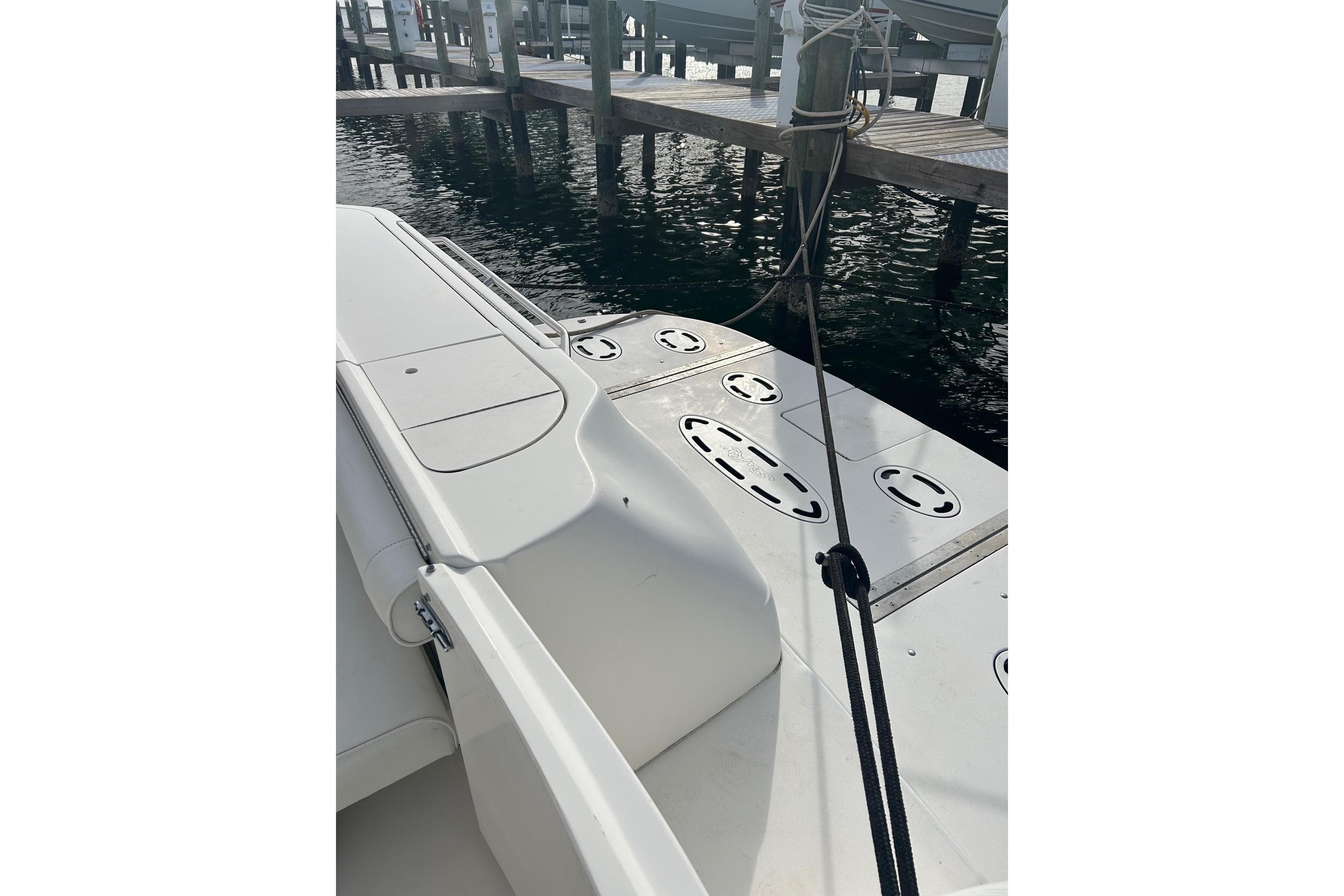 2001 Sea Ray 480 Sedan Bridge yacht docked at marina, showing deck and mooring lines.