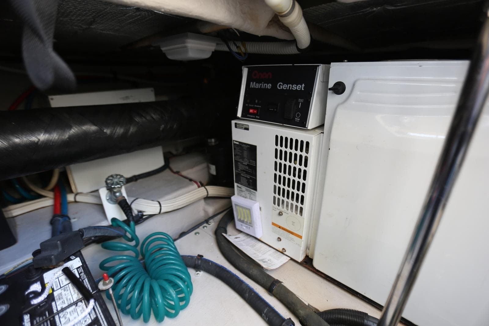 Engine room of 2004 Sea Ray 420 Sedan Bridge with Onan Marine Genset.