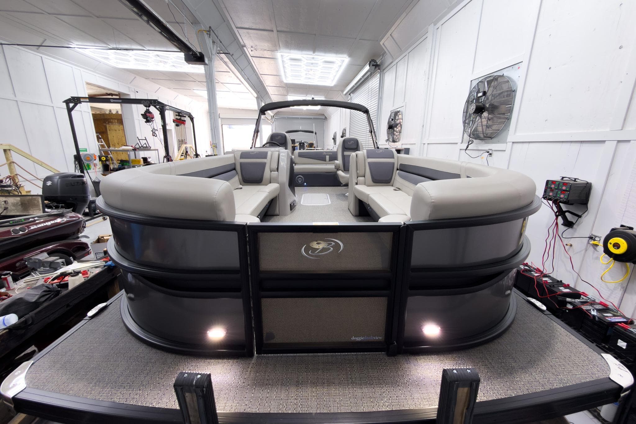 2025 Barletta Cabrio 24UC pontoon boat in a workshop setting.