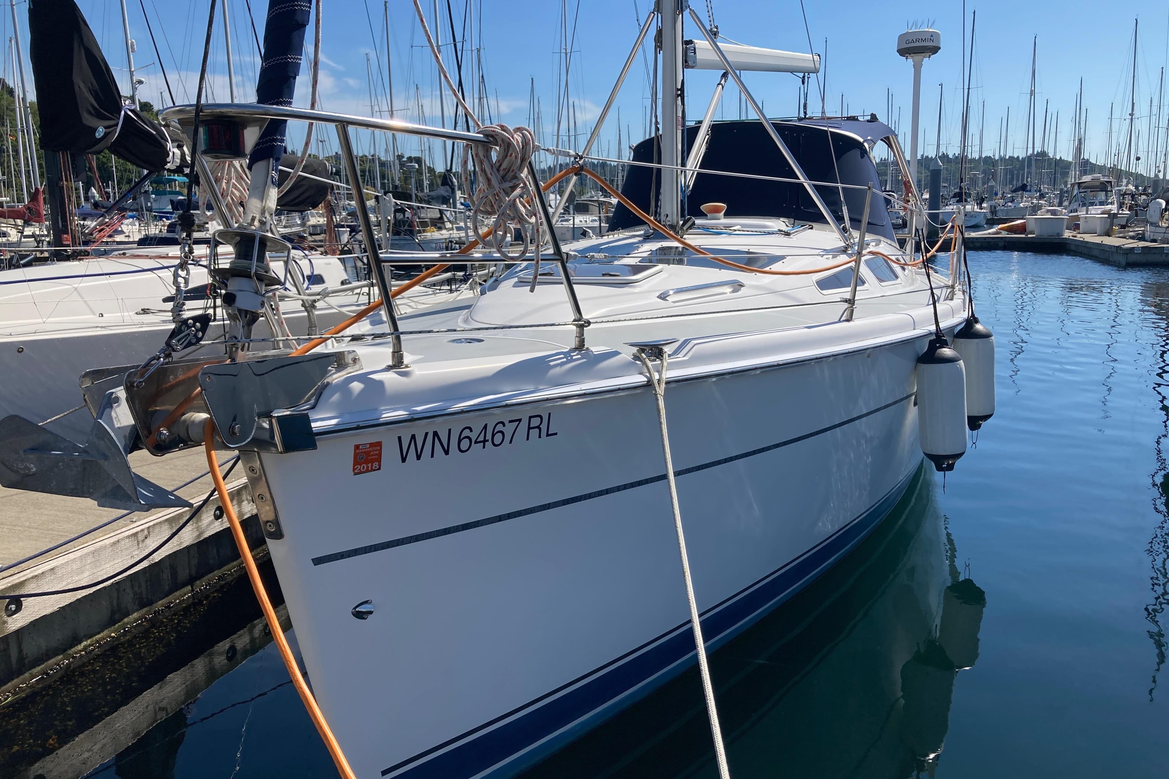 2003 Hunter 356 sailboat docked in marina, registration WN6467RL, with clear blue sky.