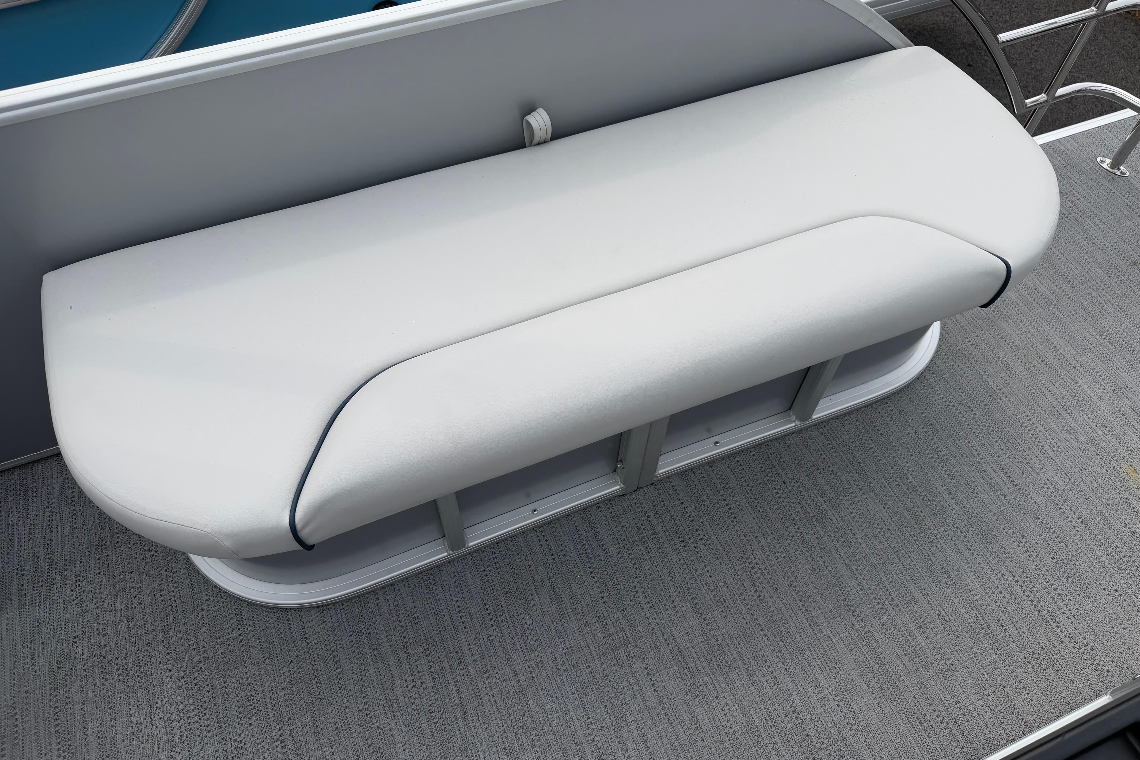 White cushioned bench seat on 2026 Godfrey SW 2286 SFLC boat deck.