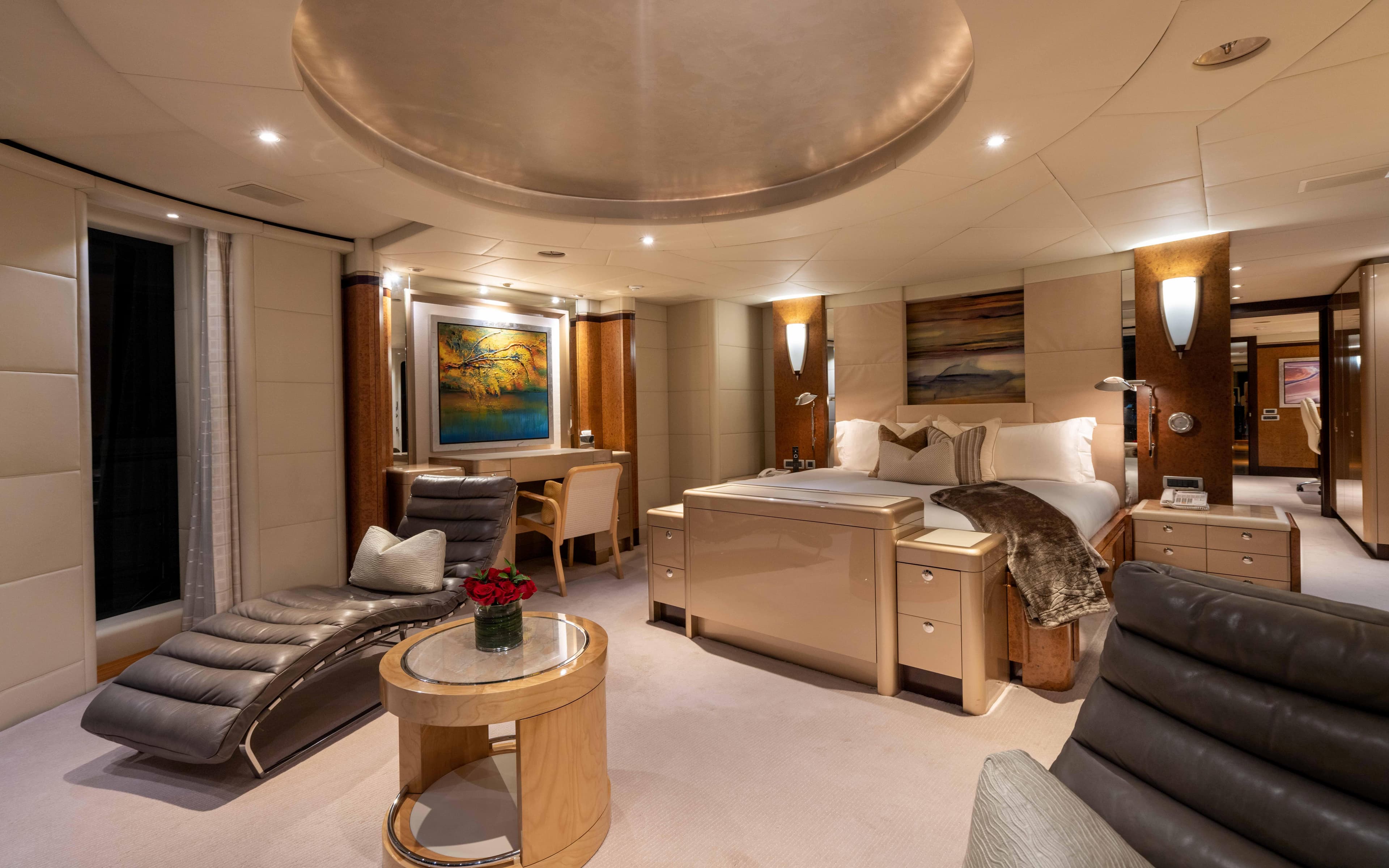 Luxurious bedroom interior of 2004 Oceanfast Full Displacement yacht with modern furnishings.