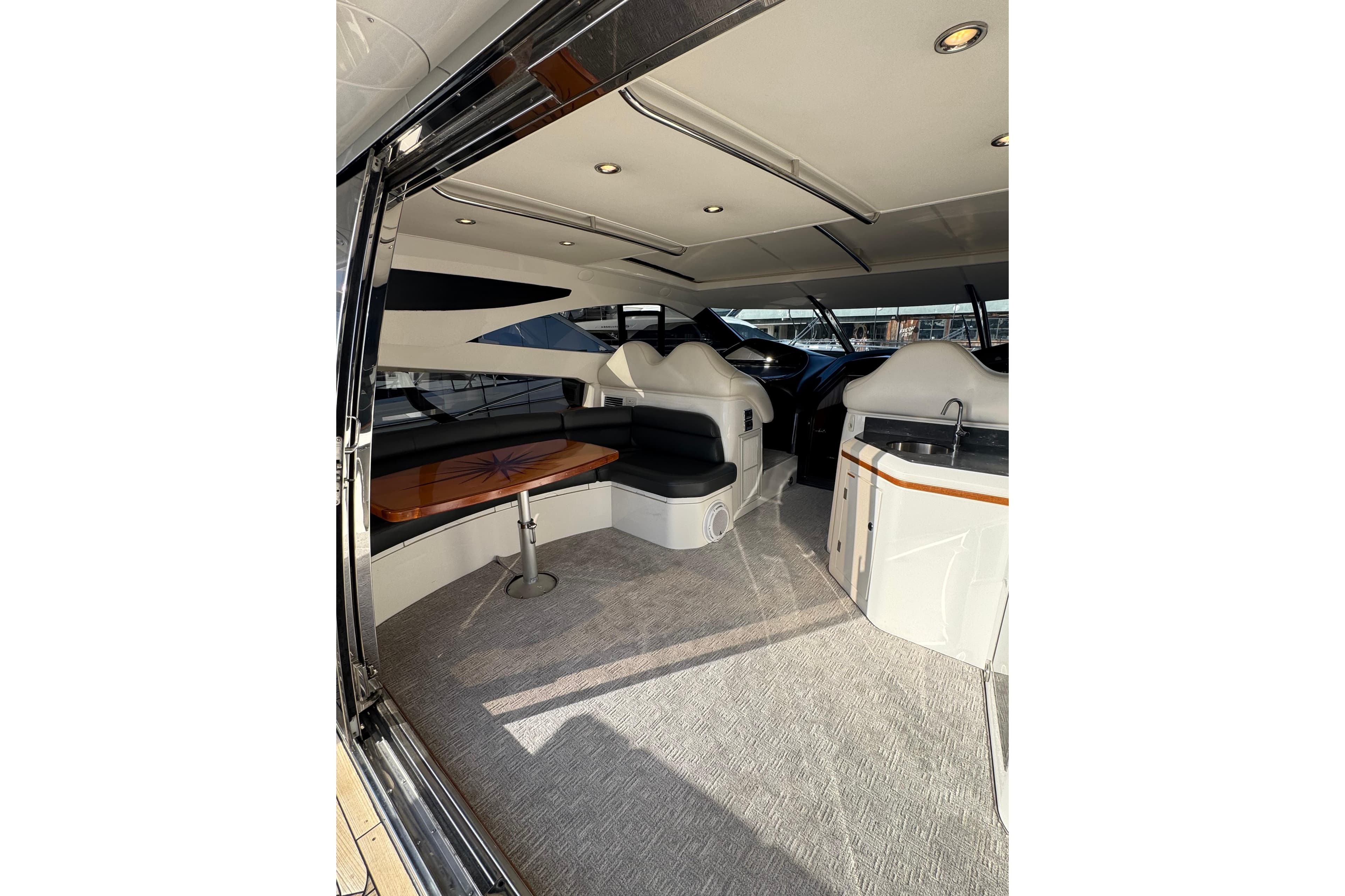 Interior of 2004 Sunseeker Predator 68 yacht with seating and table.