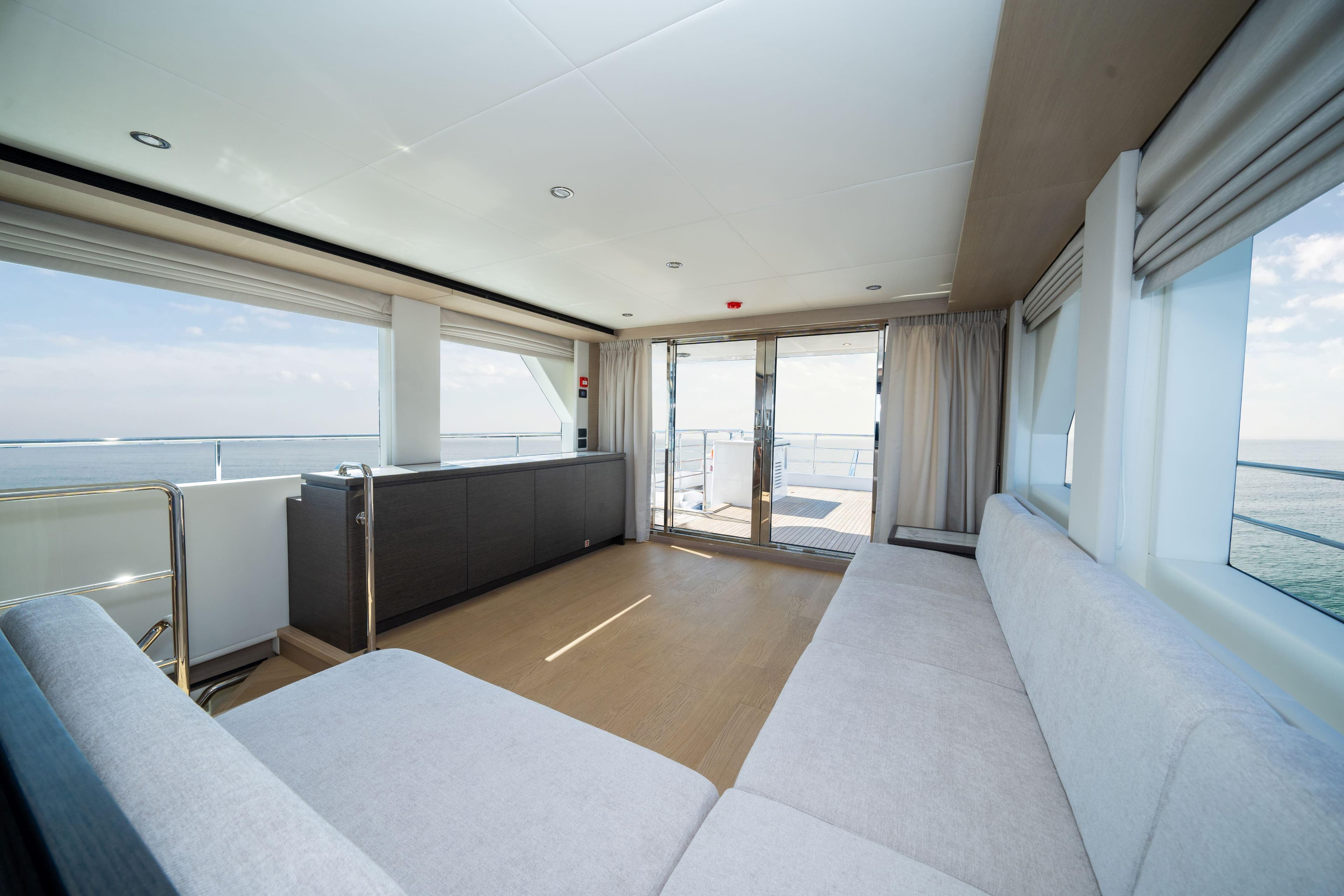 Luxurious interior of 2025 Nomad 75 SUV yacht with panoramic ocean views.