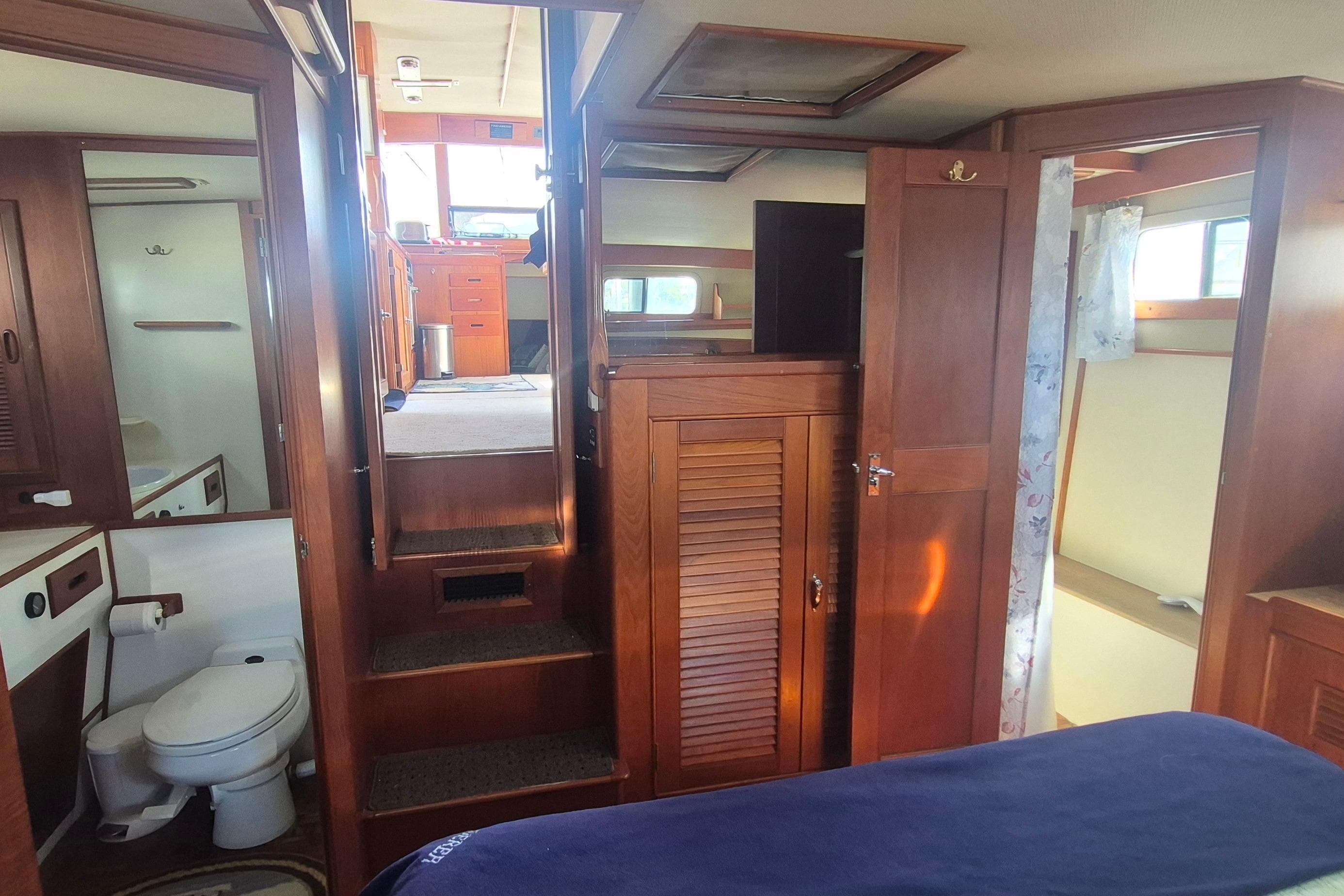 Interior of 1983 Grand Banks 42 Motoryacht with wooden cabinetry and cozy living space.