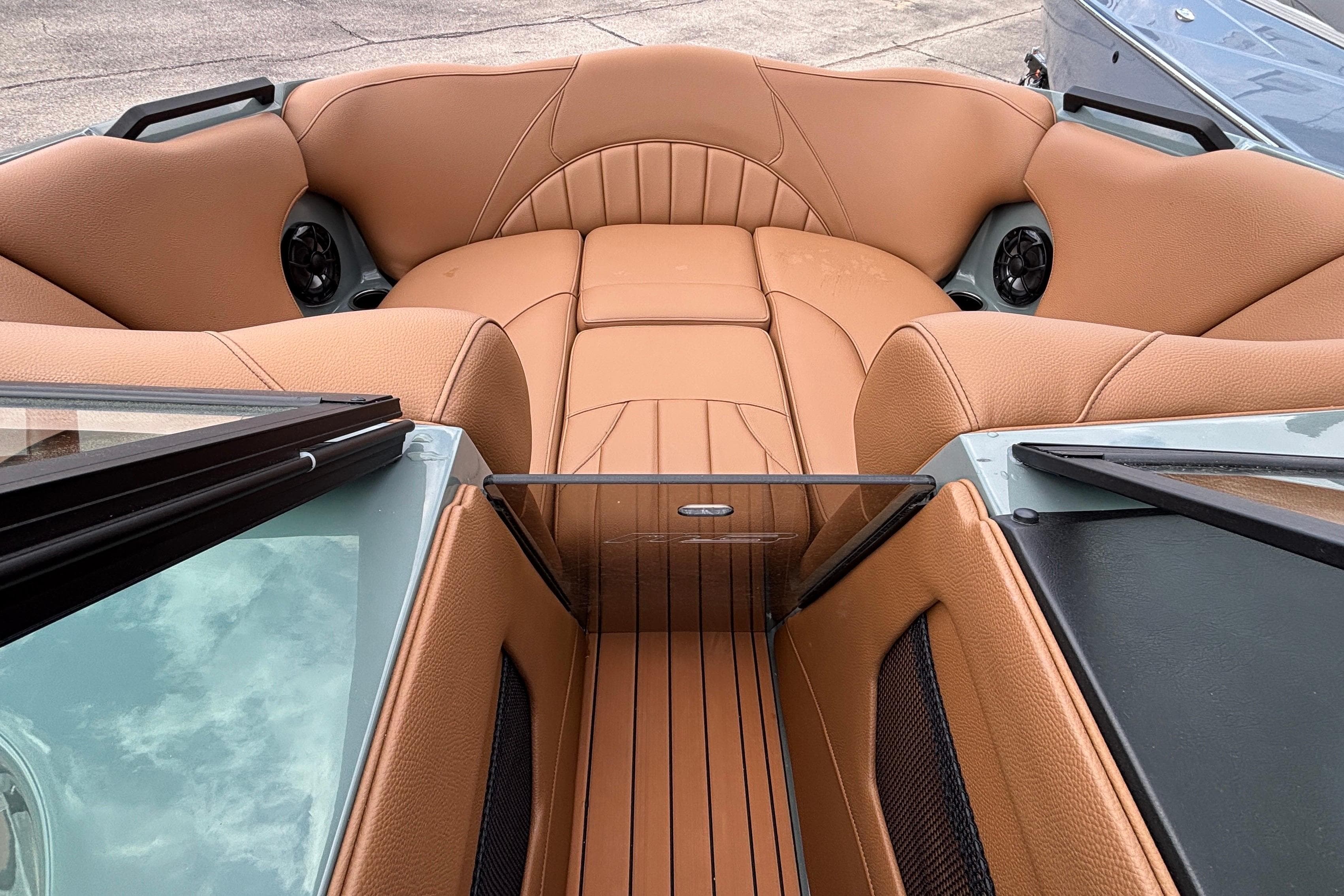 Luxurious interior of 2026 MB B52 23 Classic boat with tan leather seating.