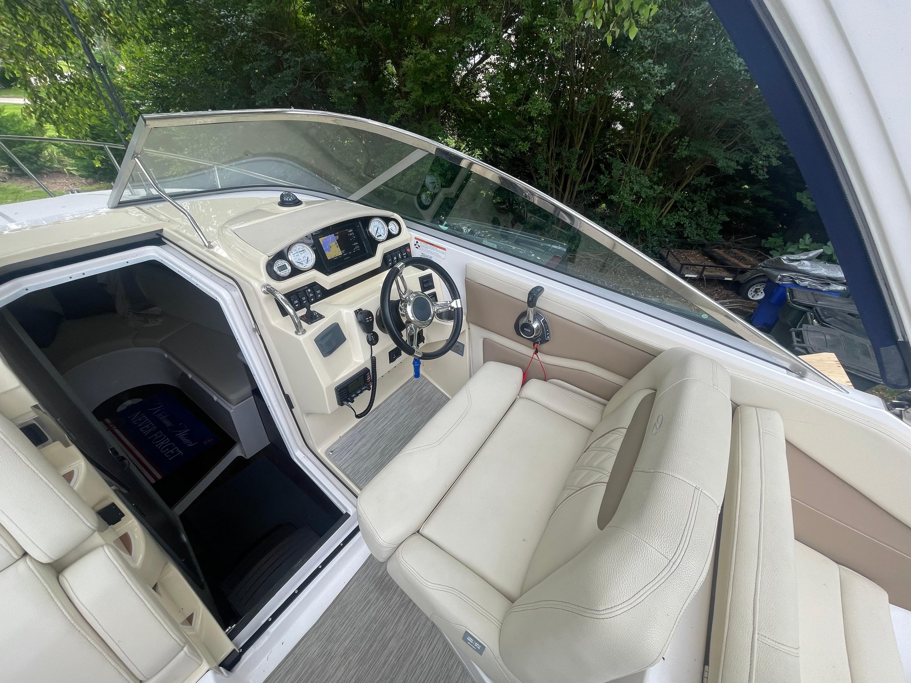 2019 Regal 28 Express boat interior with steering wheel and dashboard controls.
