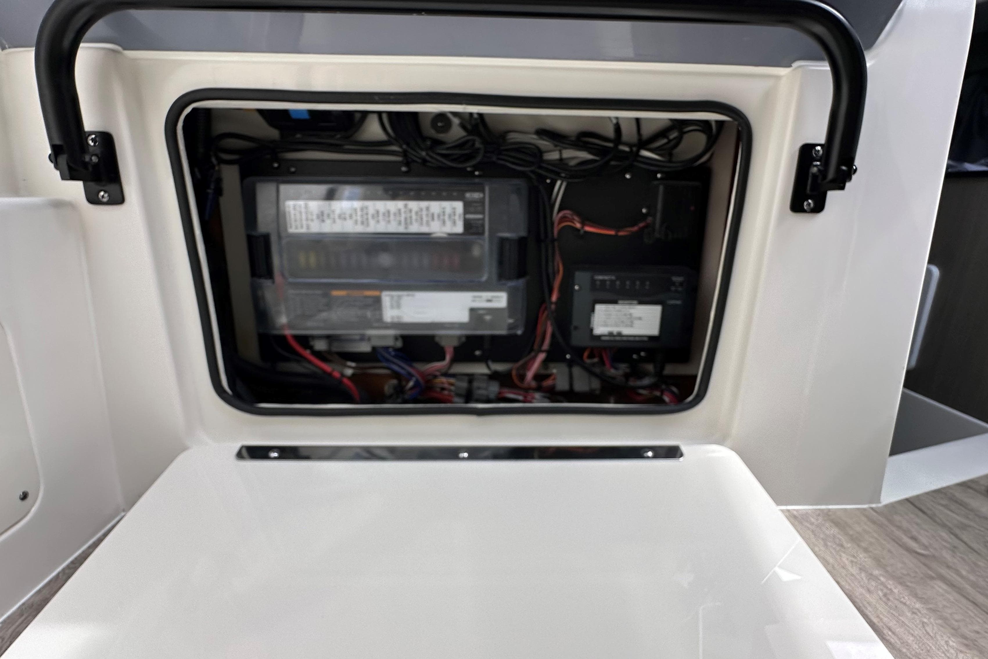 Electrical compartment of 2025 Navan C30, showcasing wiring and components.