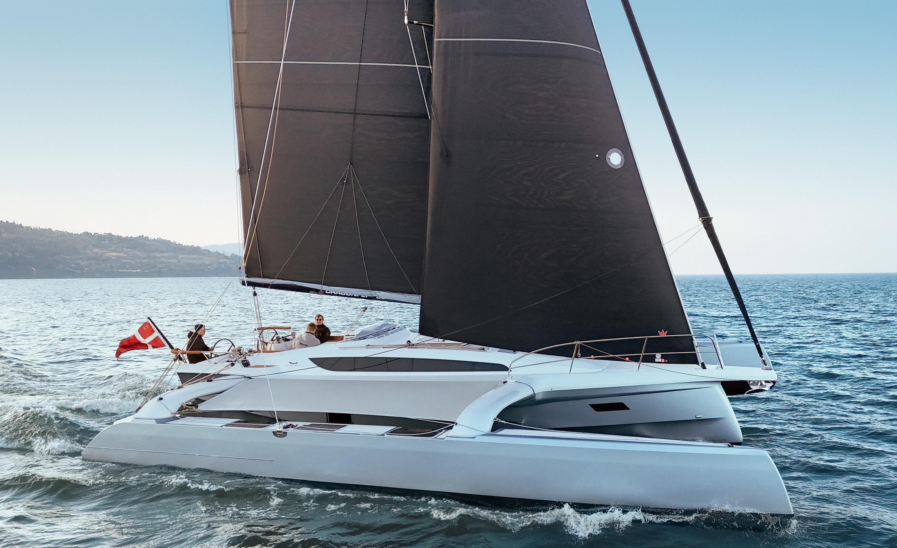 Sleek Dragonfly 36 sailboat gliding on open sea, 2027 model.