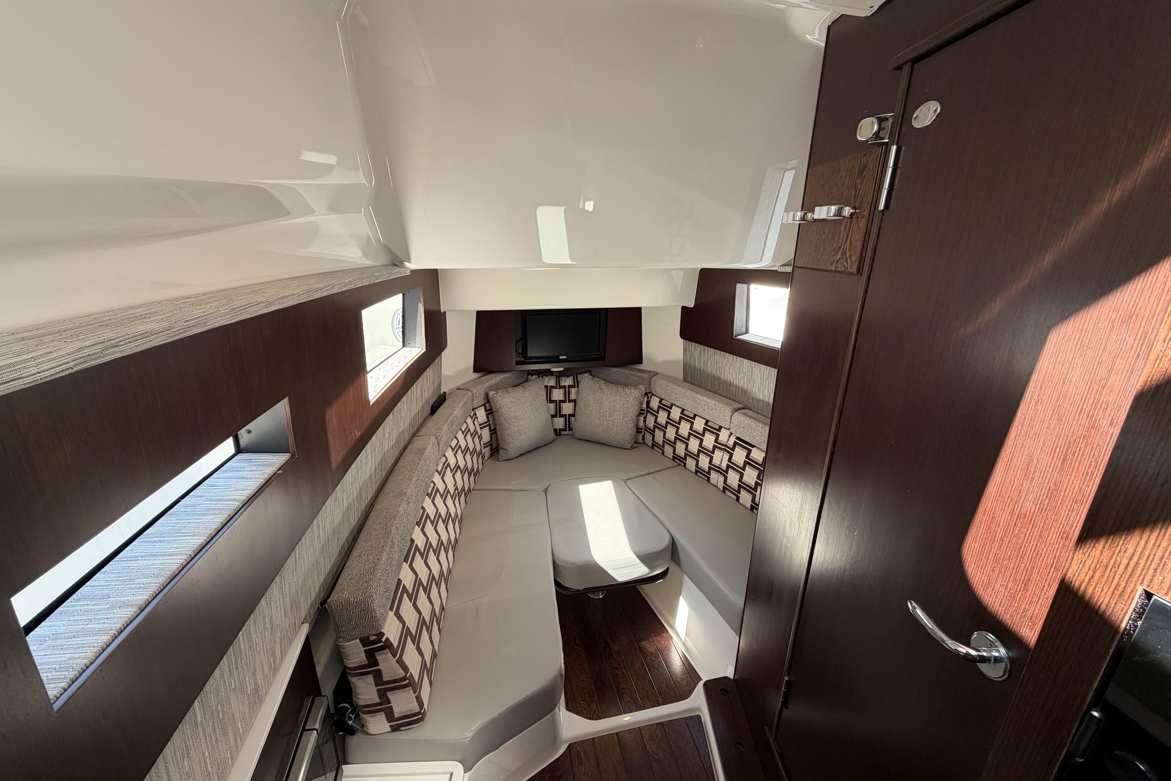 Luxurious interior of 2021 Pursuit S 378 Sport boat with elegant seating and modern design.