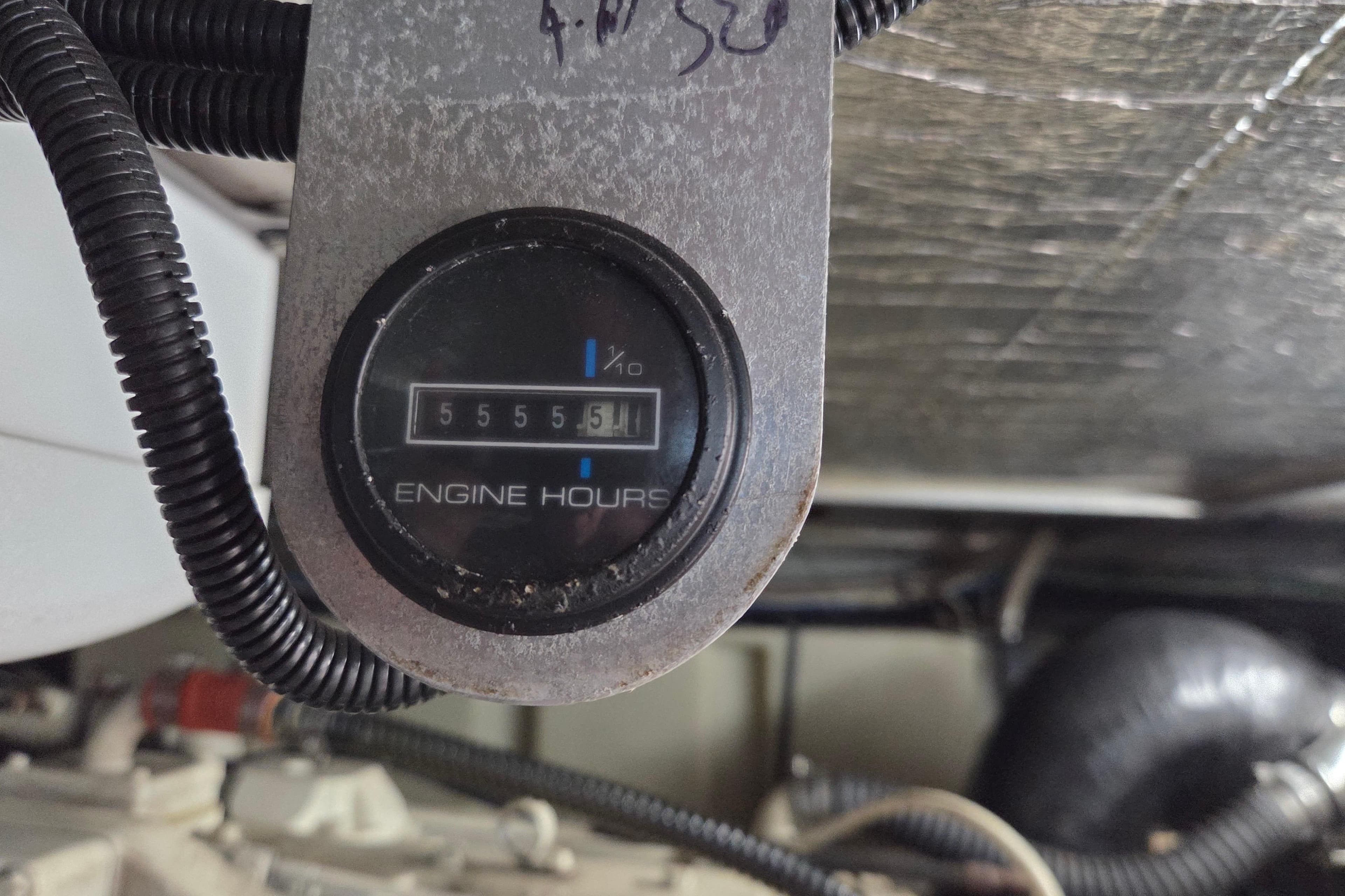 Engine hour meter showing 5555.5 hours on a 2000 Carver 450 Voyager Pilothouse.