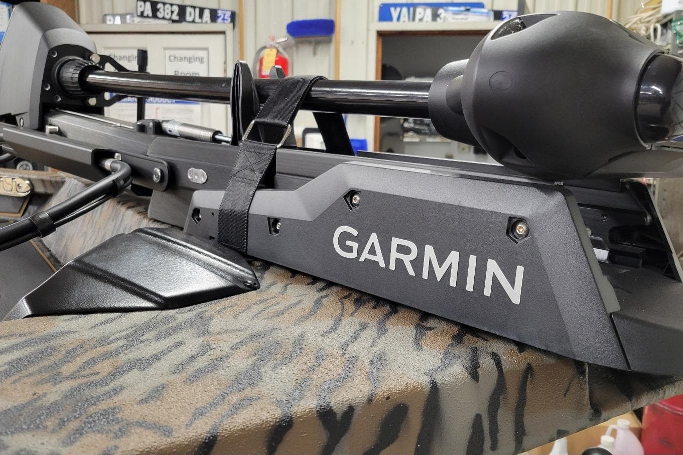 Garmin device mounted on Xpress X19 Pro 2026 boat with camouflage pattern.