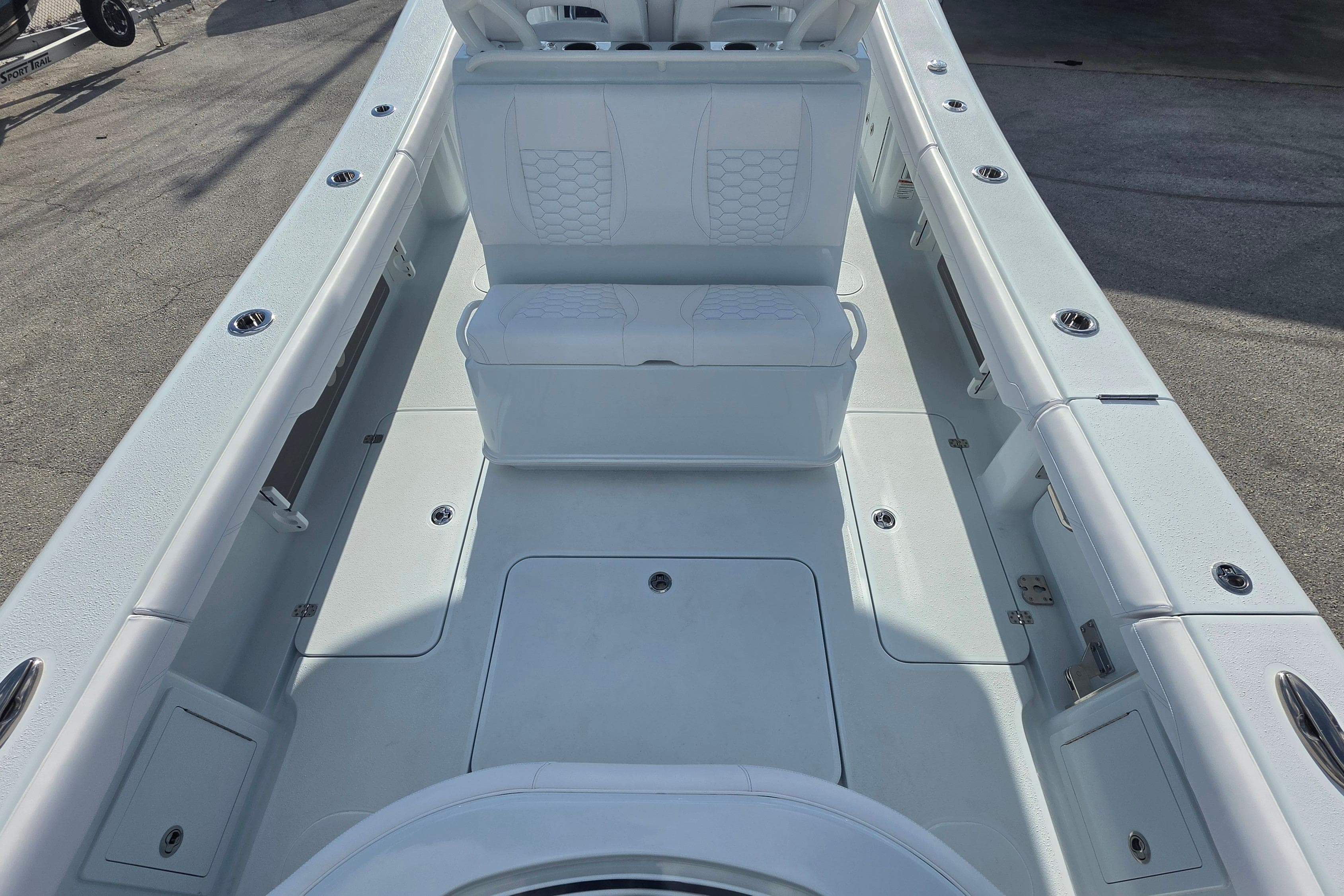 2026 Yellowfin 36 Offshore boat interior with white seating and spacious deck layout.