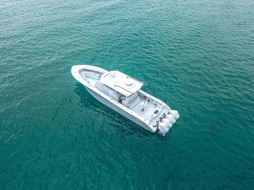 Aerial view of 2019 Yellowfin 42 boat on clear blue water.