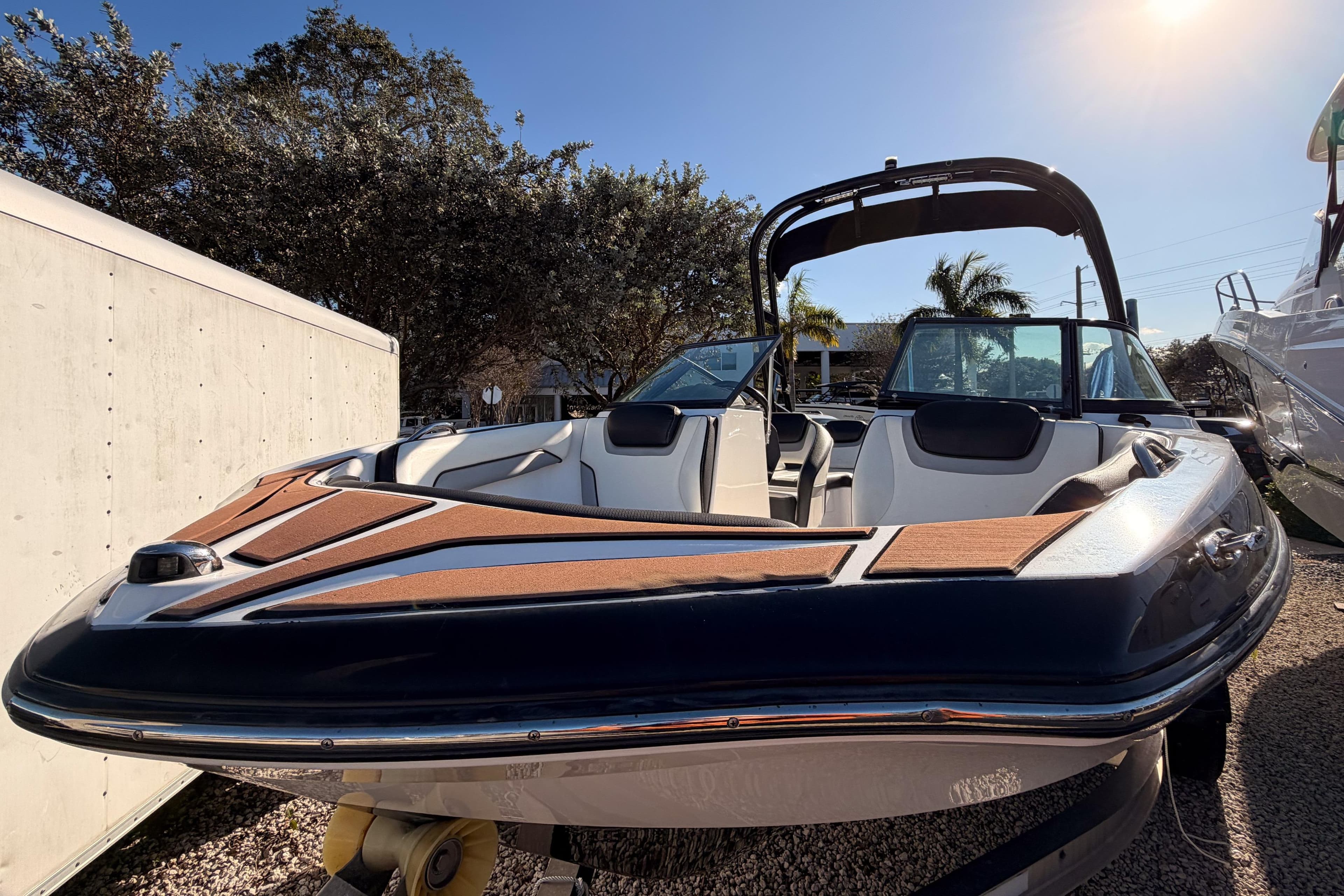 2017 Yamaha Boats AR195, sleek design, parked outdoors under clear sky.