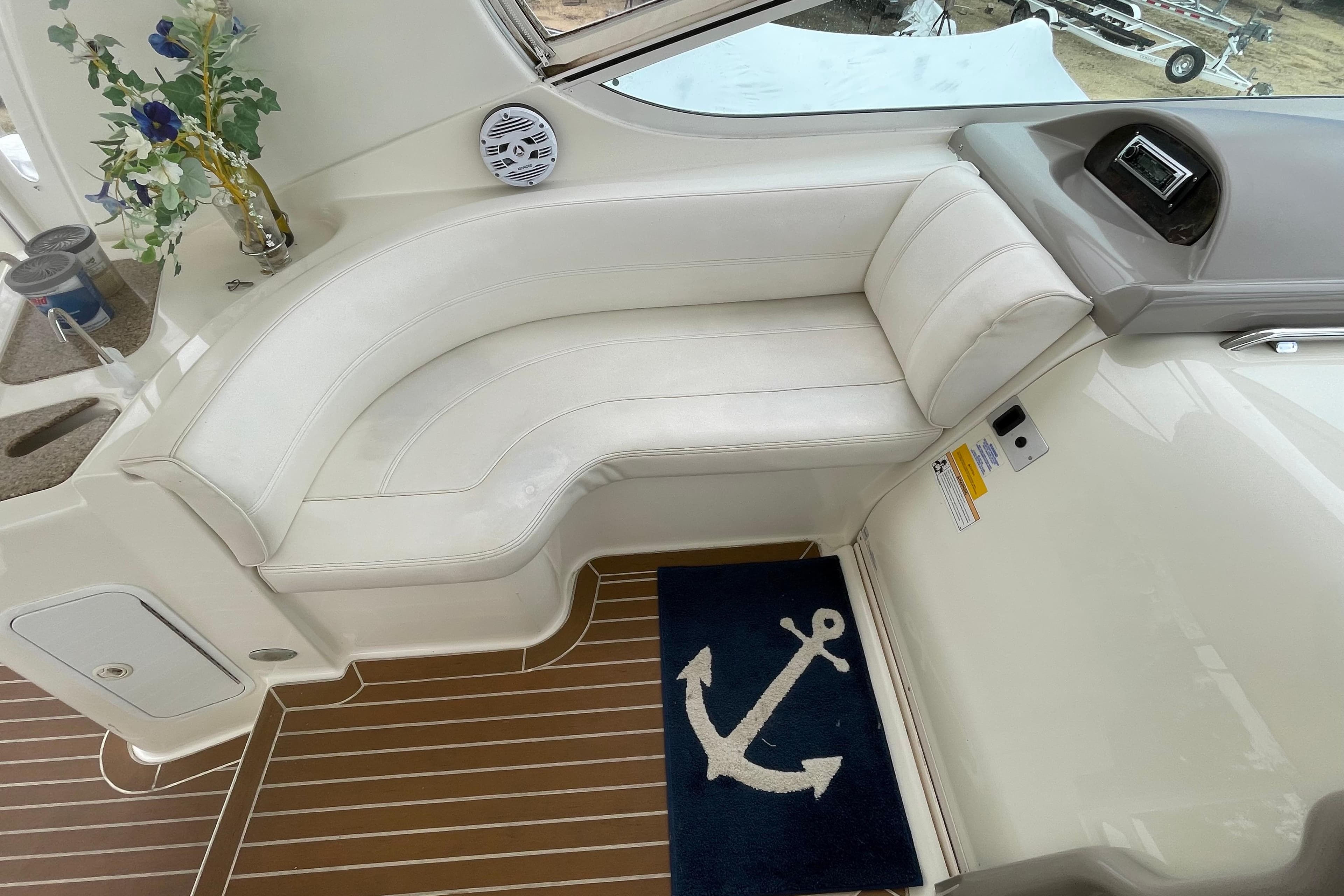 Luxurious interior of 2004 Cruisers Yachts 455 Express Motoryacht with white seating and nautical decor.