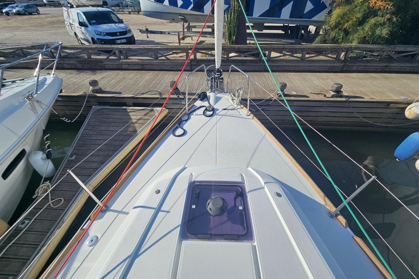 Beneteau Oceanis 35.1 sailboat docked, showcasing deck and rigging, 2016 model.