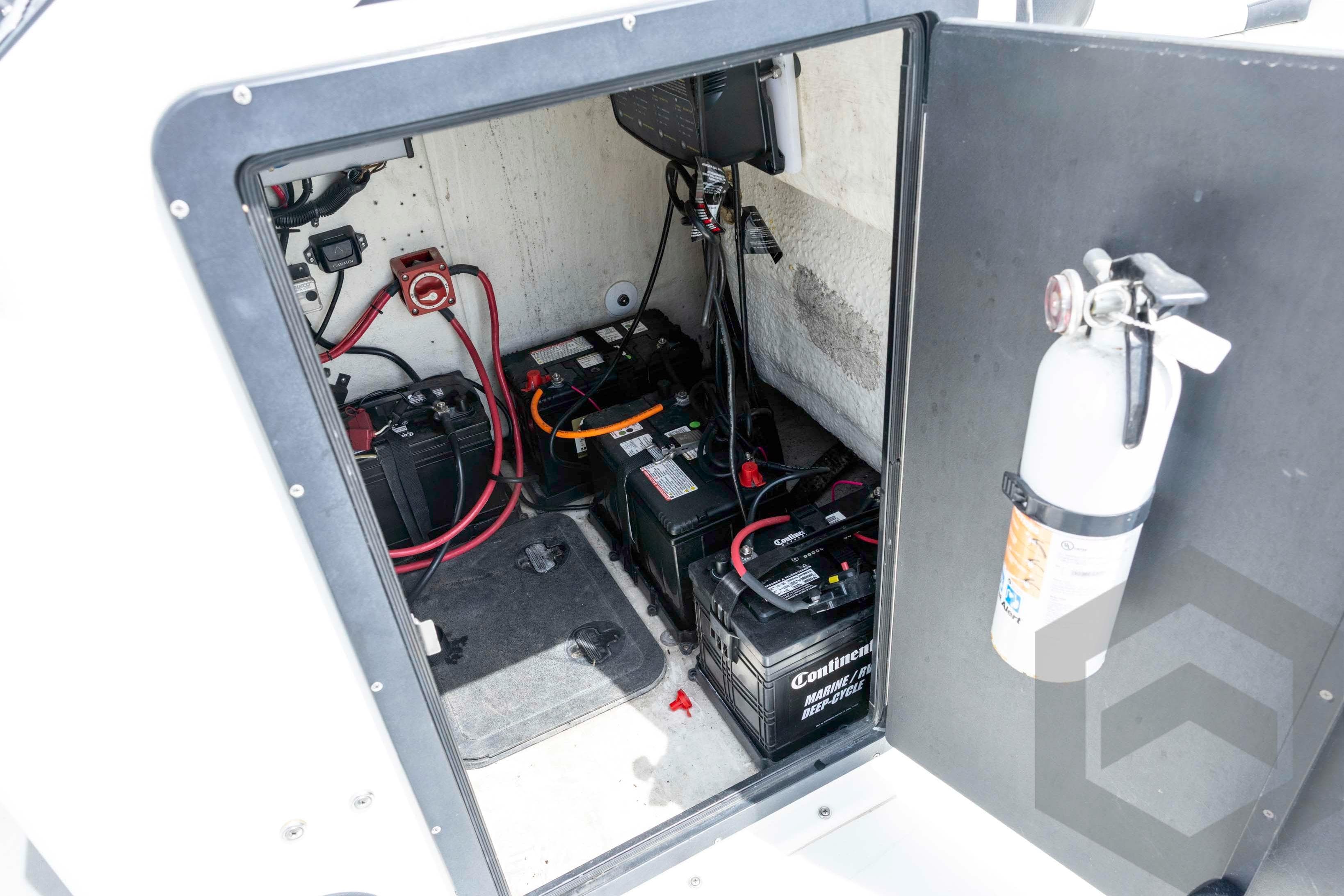 2018 Bay Rider 238 Bay boat battery compartment with fire extinguisher and wiring.