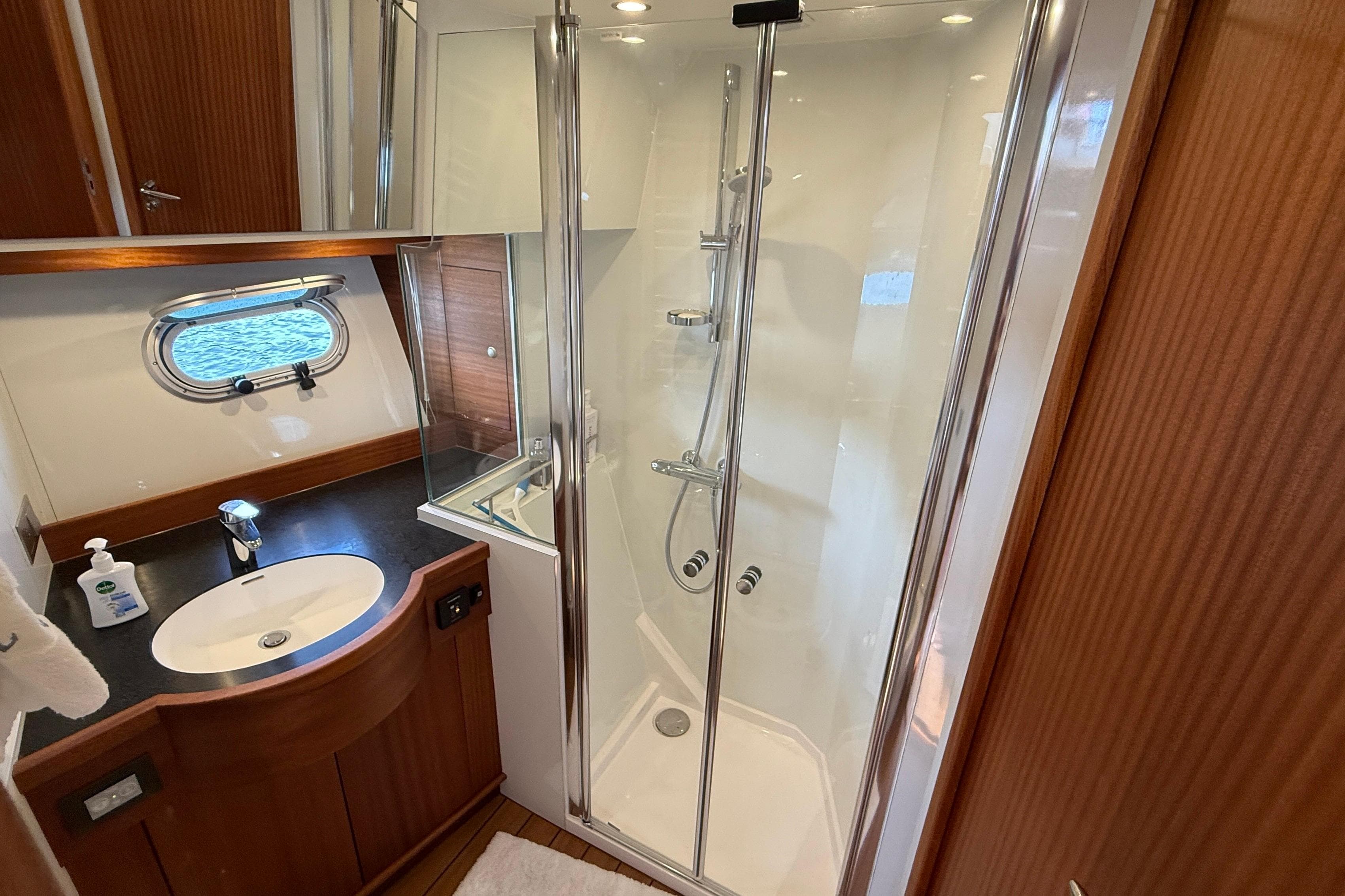 Luxurious bathroom in 2021 Elling E6 yacht with shower and sink.