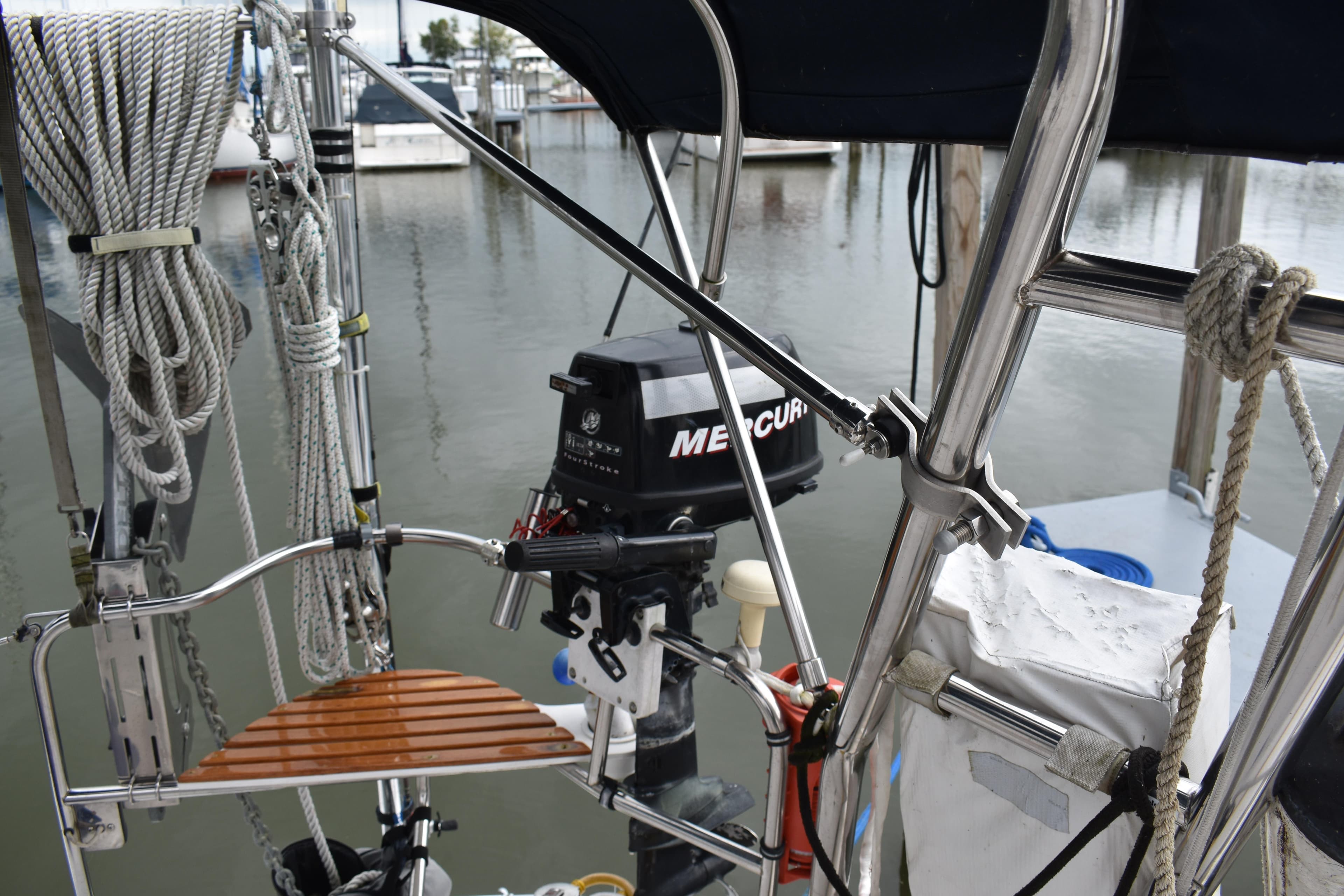 2003 Hunter 386 sailboat with Mercury outboard motor at marina.