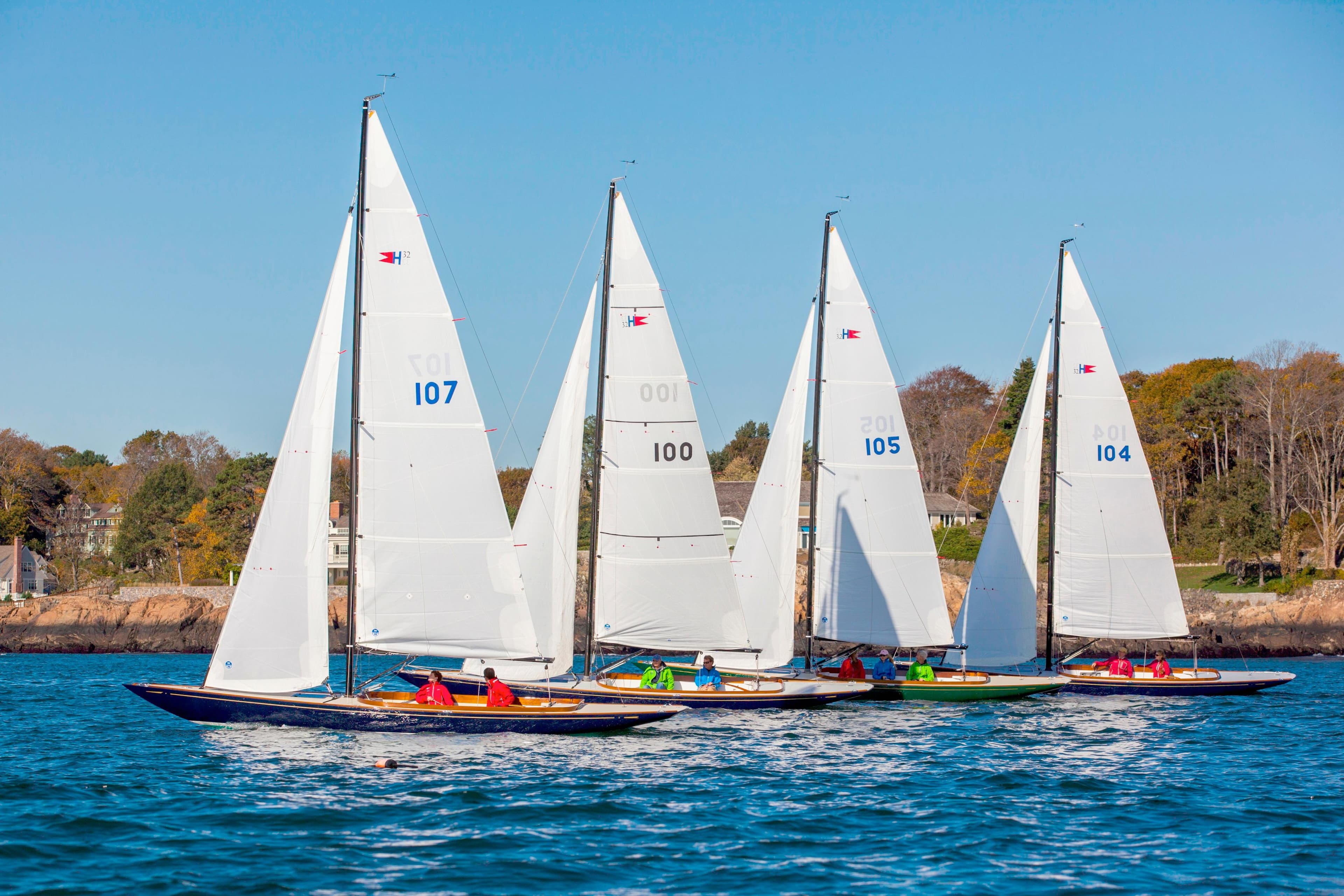 Four C.W. Hood 32 Daysailers racing on a sunny day, 2026 model.