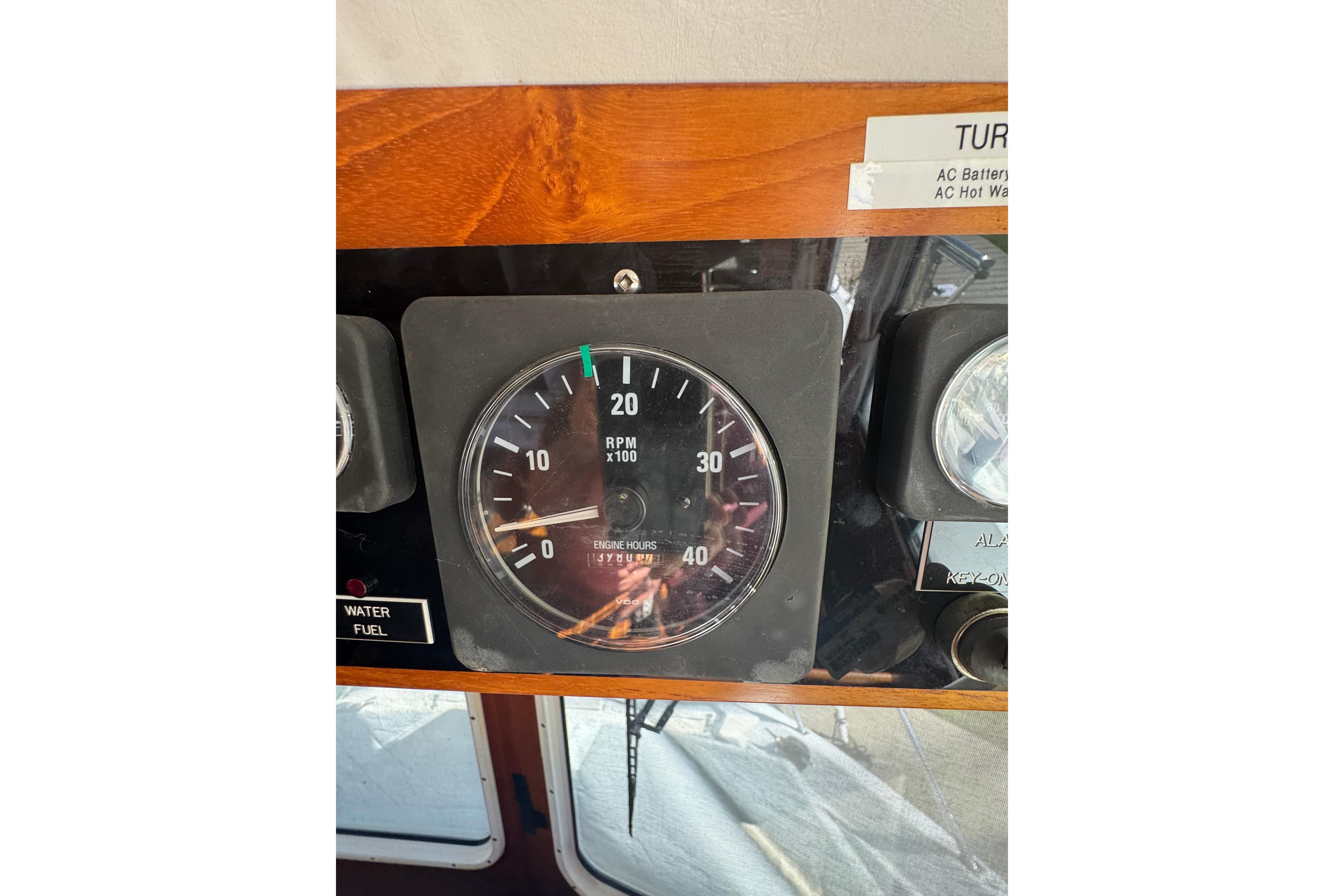 RPM gauge on 2001 Monk Trawler dashboard, showing engine hours and controls.